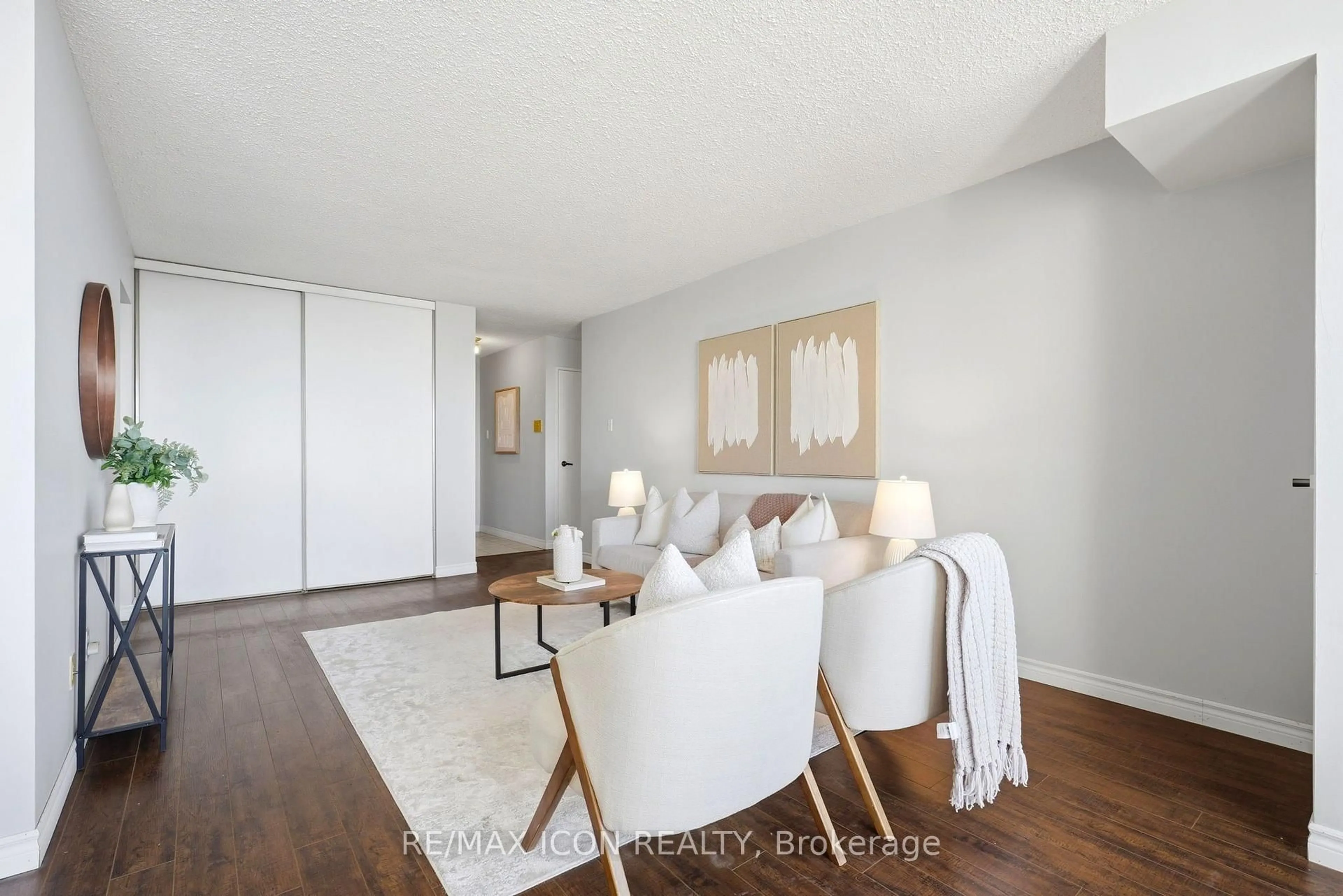 Living room with furniture, wood/laminate floor for 375 King St #708, Waterloo Ontario N2J 4L6