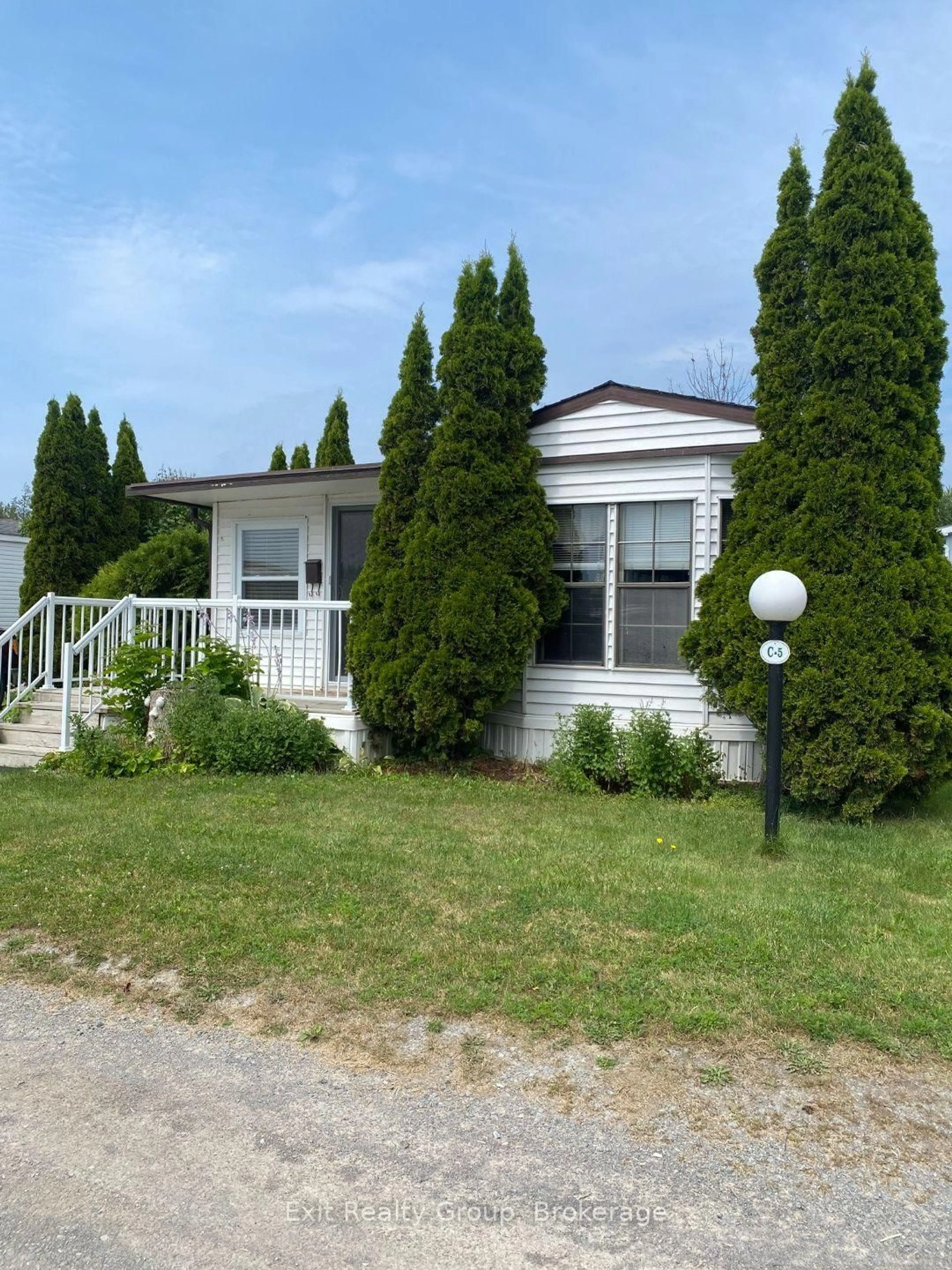 Home with vinyl exterior material, street for 153 County Road 27 #C5, Prince Edward County Ontario K0K 1T0