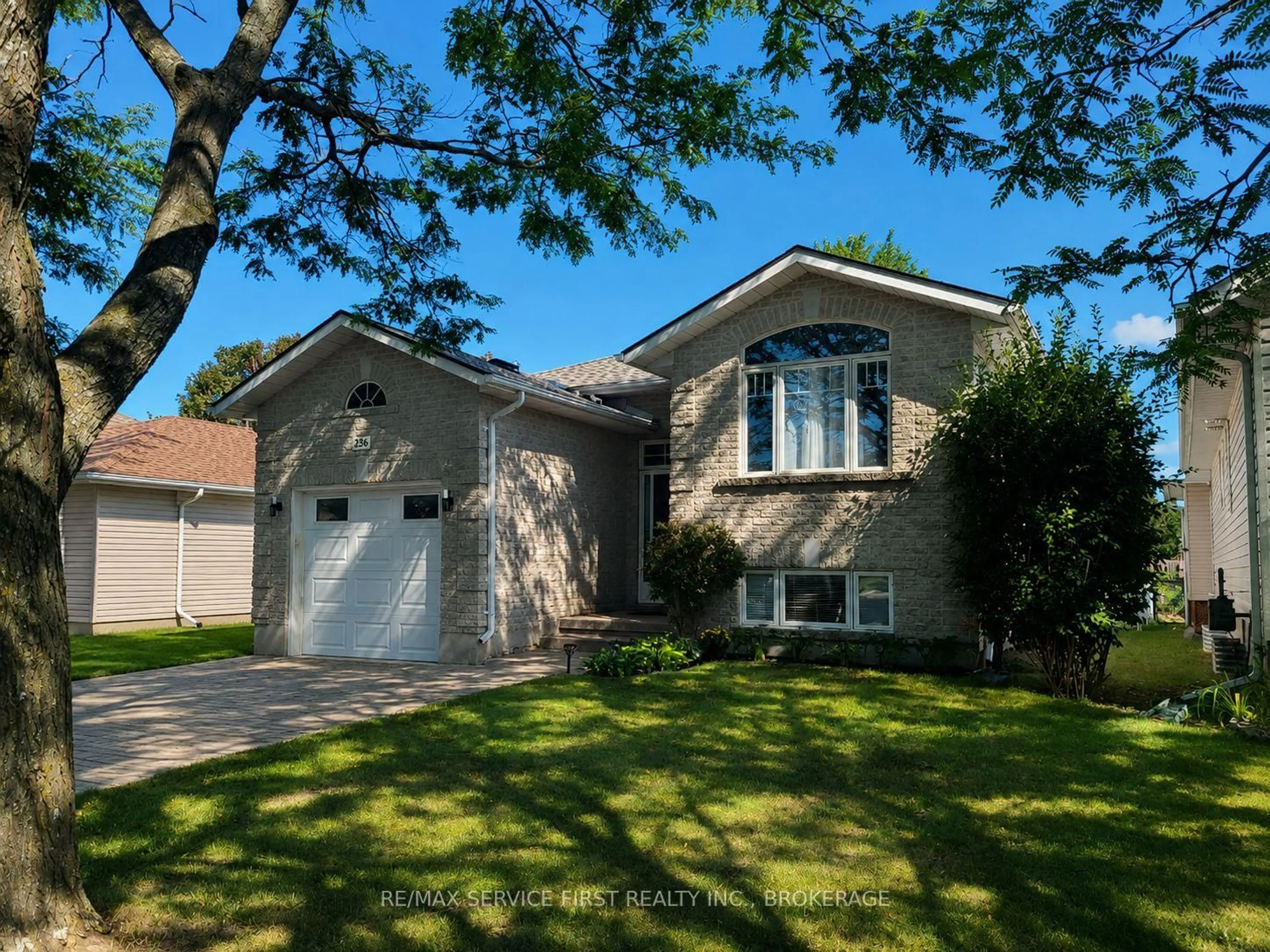 Home with vinyl exterior material, street for 236 Langfield St, Kingston Ontario K7P 3C8
