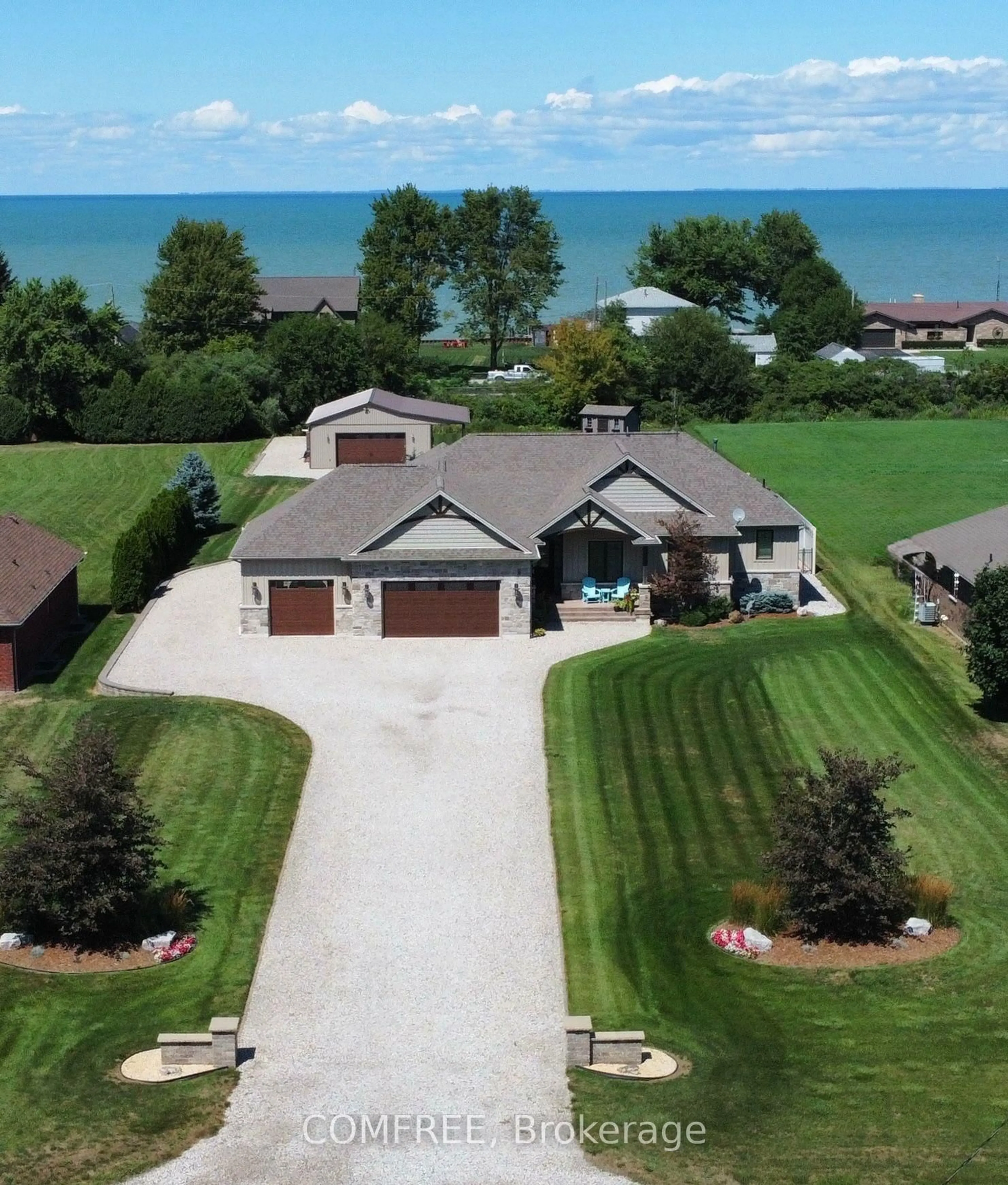 A pic from outside/outdoor area/front of a property/back of a property/a pic from drone, water/lake/river/ocean view for 663 County 2 Rd, Lakeshore Ontario N8L 1K3