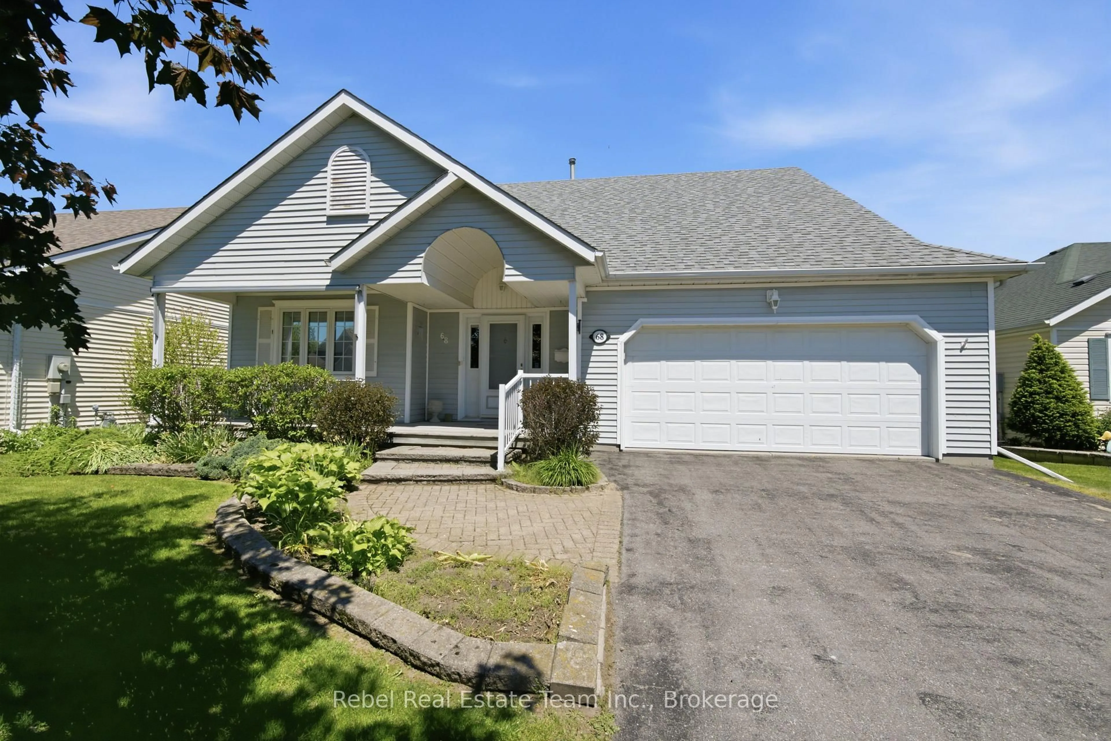 Home with vinyl exterior material, street for 68 Mills Rd, Brighton Ontario K0K 1H0