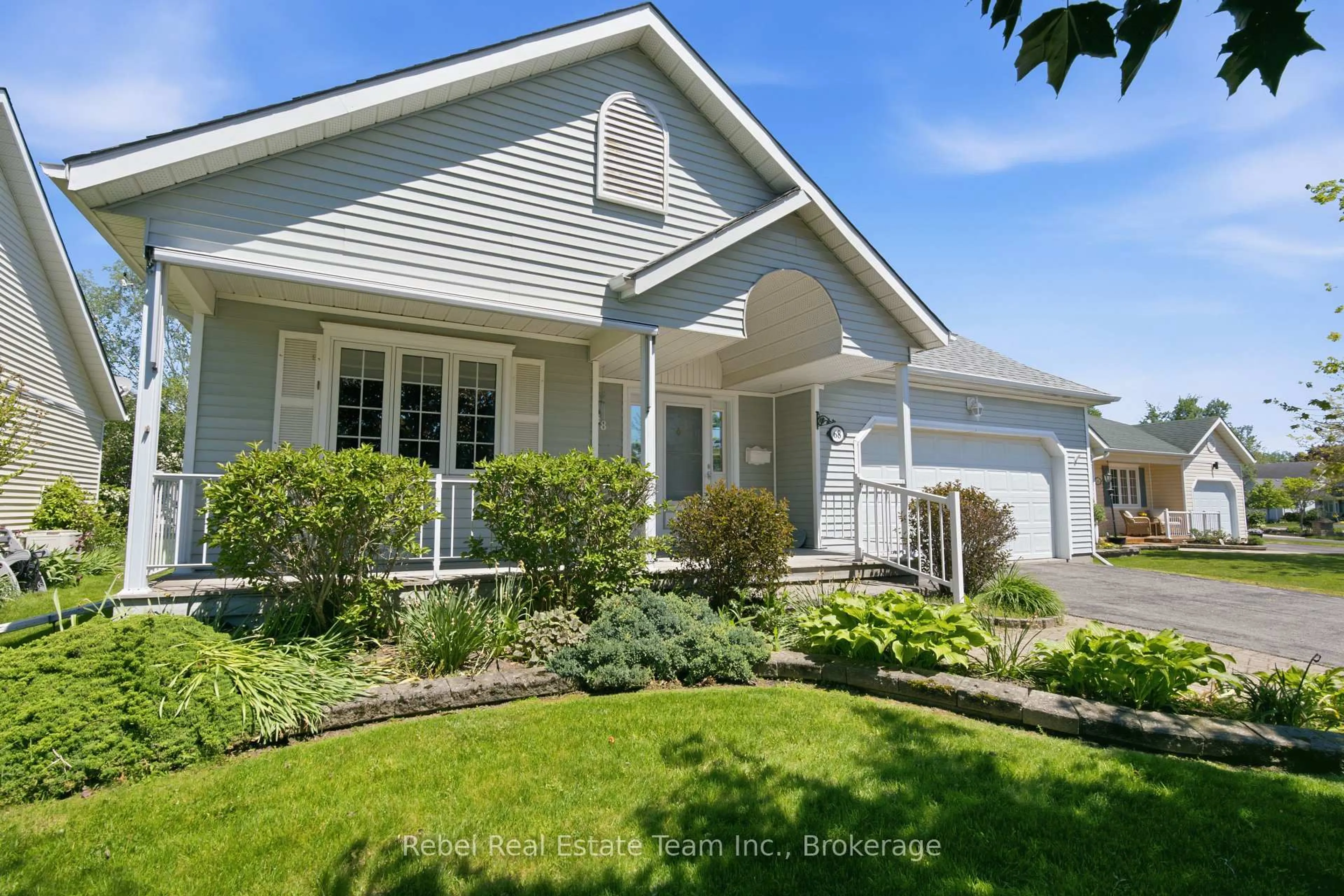 Home with vinyl exterior material, street for 68 Mills Rd, Brighton Ontario K0K 1H0