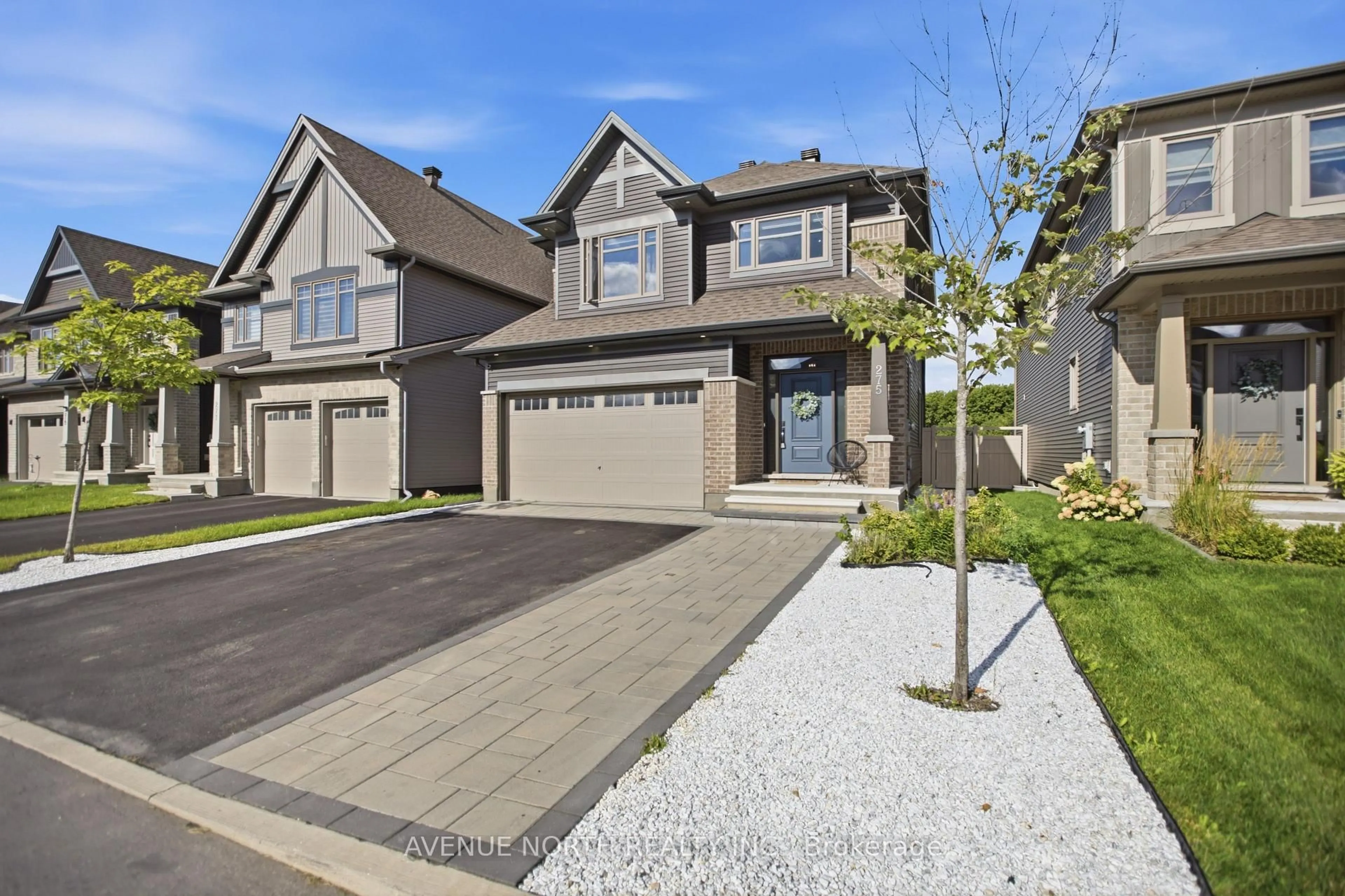 Home with brick exterior material, street for 275 Trollius Way, Ottawa Ontario K1T 0S2