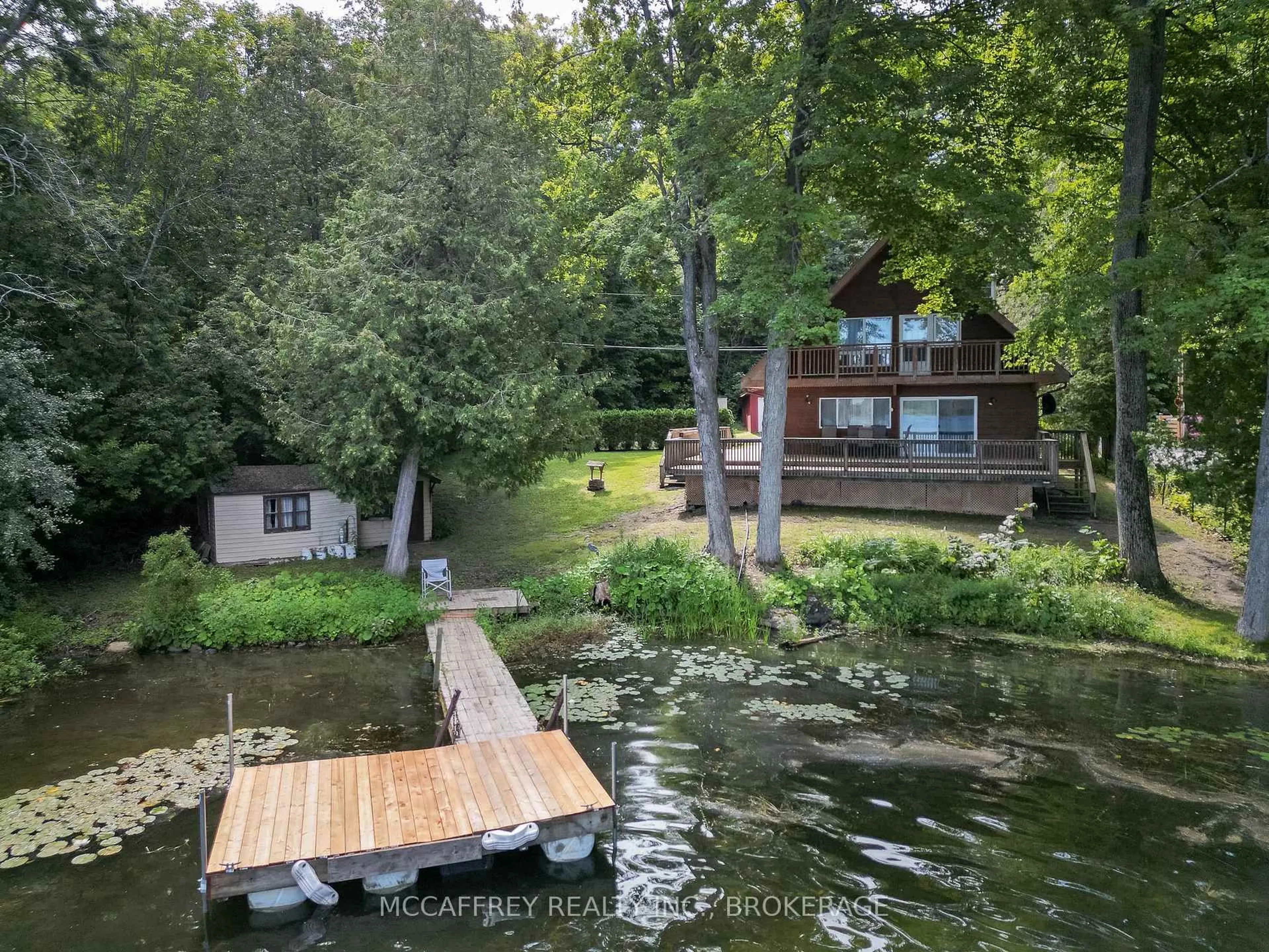 A pic from outside/outdoor area/front of a property/back of a property/a pic from drone, water/lake/river/ocean view for 3050 Ernie Lane, Battersea Ontario K0H 1H0
