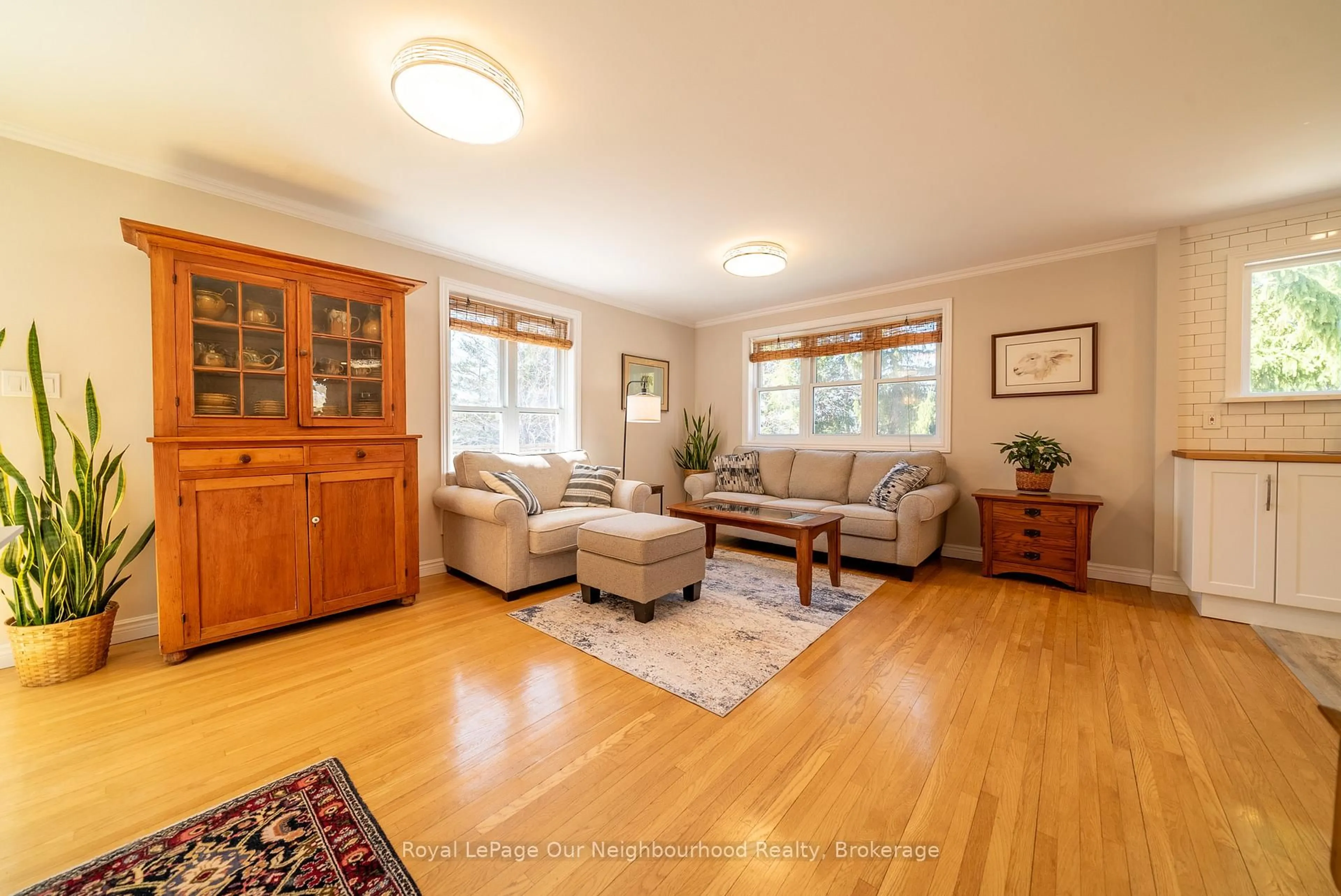 Living room with furniture, wood/laminate floor for 504 Wiley Rd, Quinte West Ontario K0K 3M0