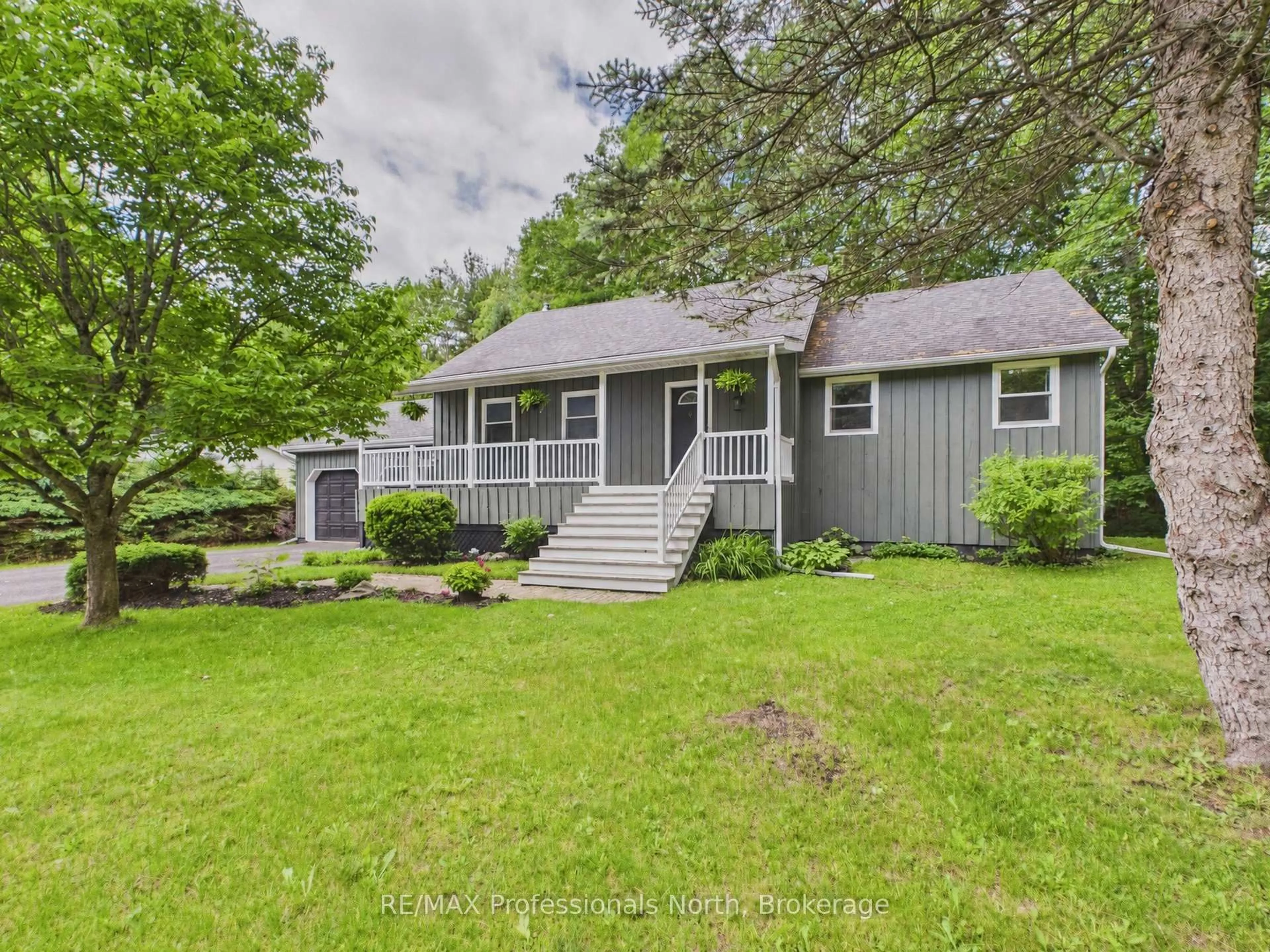 Home with vinyl exterior material, street for 1130 Cedar Lane, Bracebridge Ontario P1L 1L5