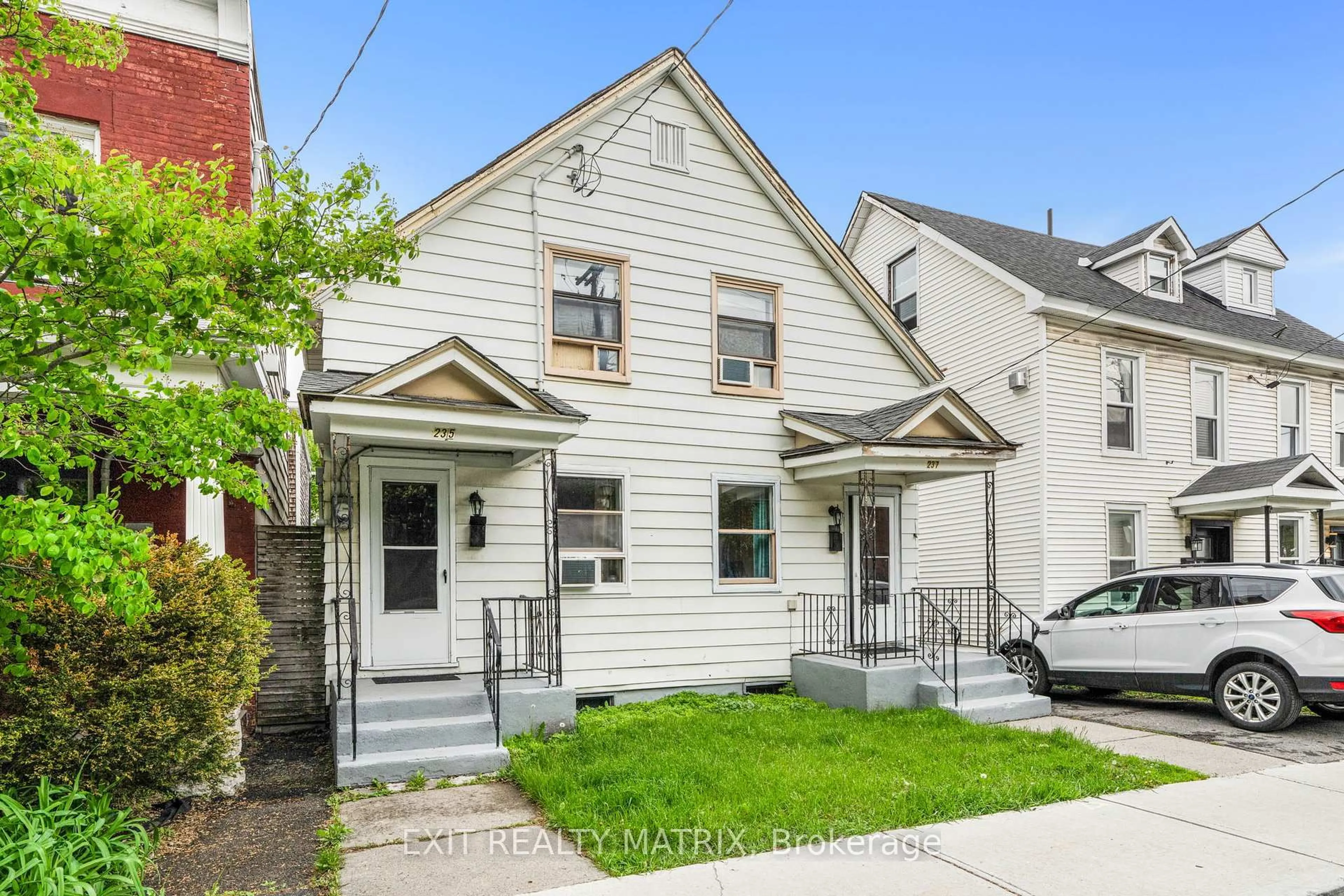 Home with brick exterior material, street for 235-237 Guigues Ave, Ottawa Ontario K1N 5J3