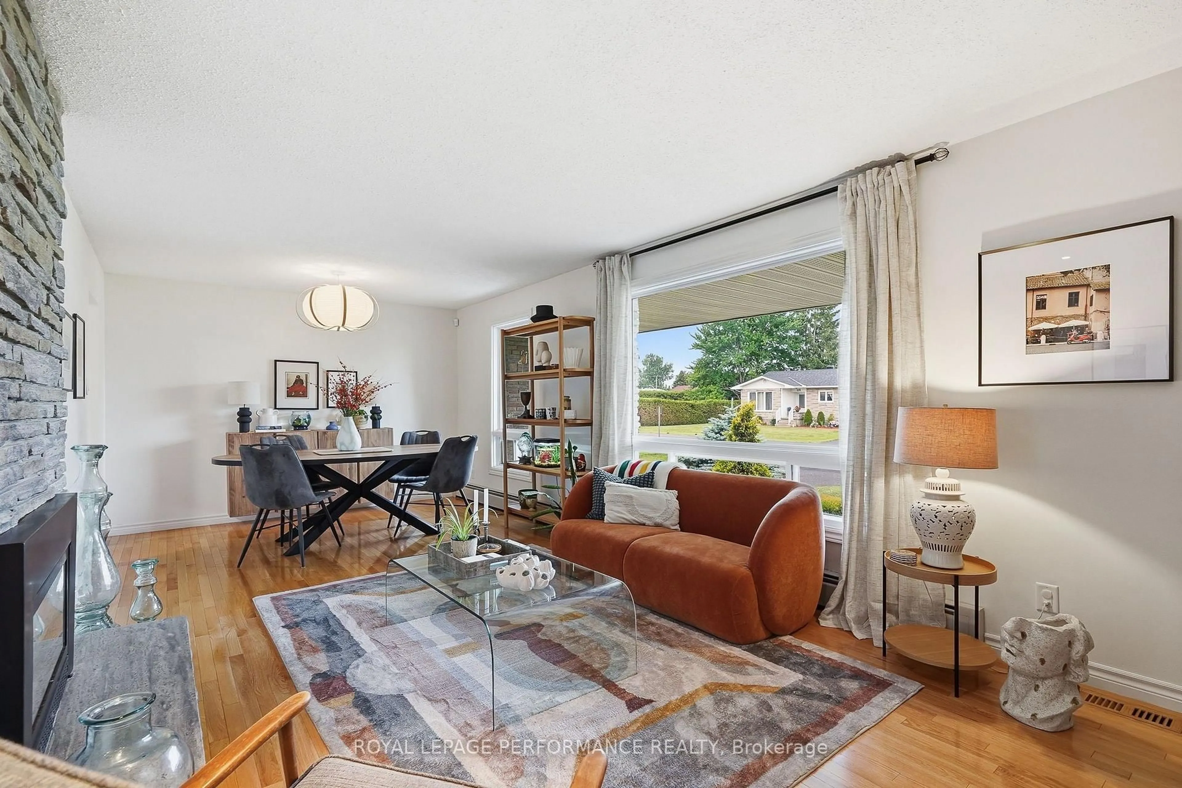 Living room with furniture, wood/laminate floor for 119 Centenaire St, Russell Ontario K0A 1W0