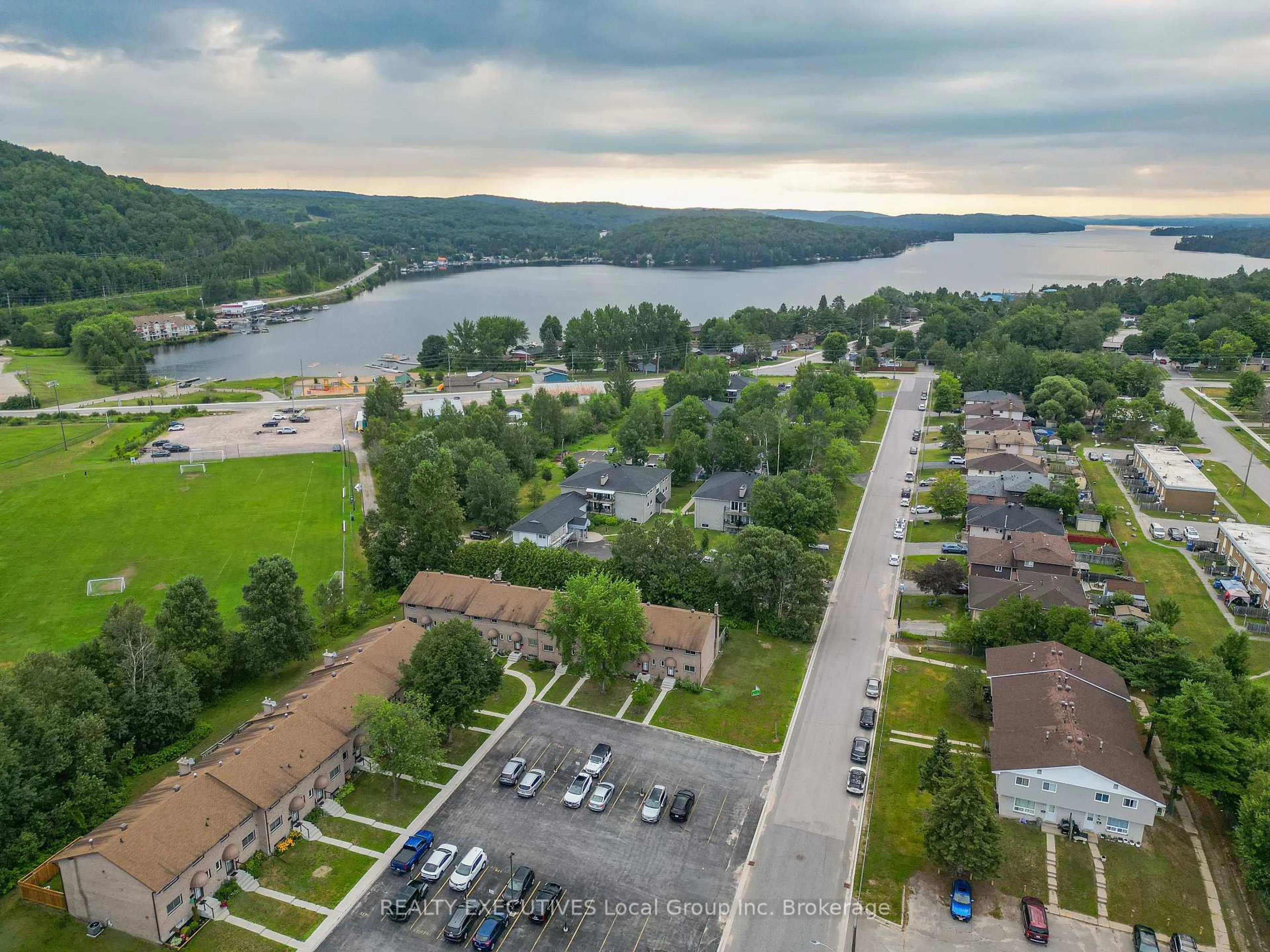 A pic from outside/outdoor area/front of a property/back of a property/a pic from drone, water/lake/river/ocean view for 398 Wickstead Ave #36, North Bay Ontario P1A 3L8