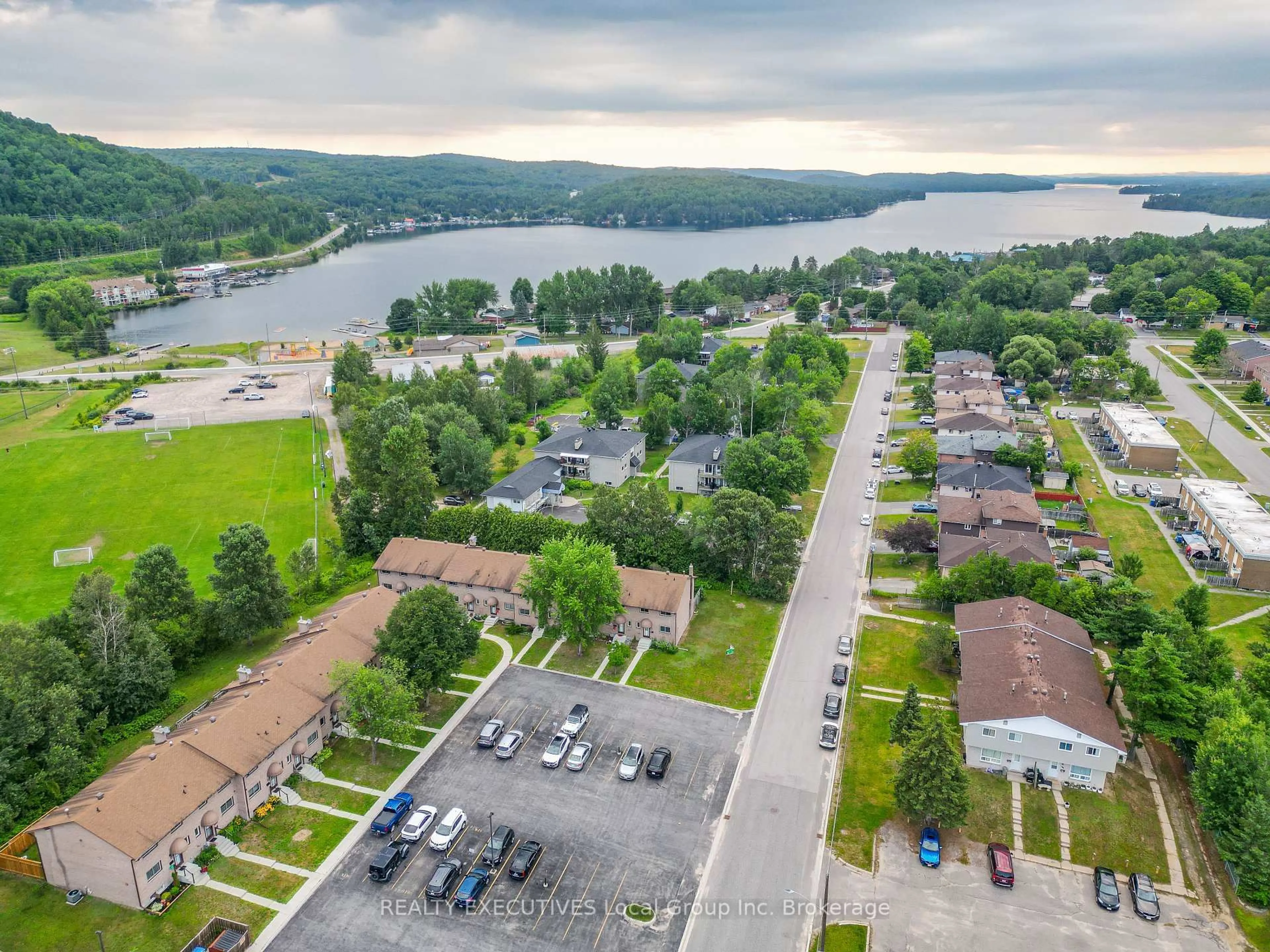 A pic from outside/outdoor area/front of a property/back of a property/a pic from drone, water/lake/river/ocean view for 398 Wickstead Ave #36, North Bay Ontario P1A 3L8