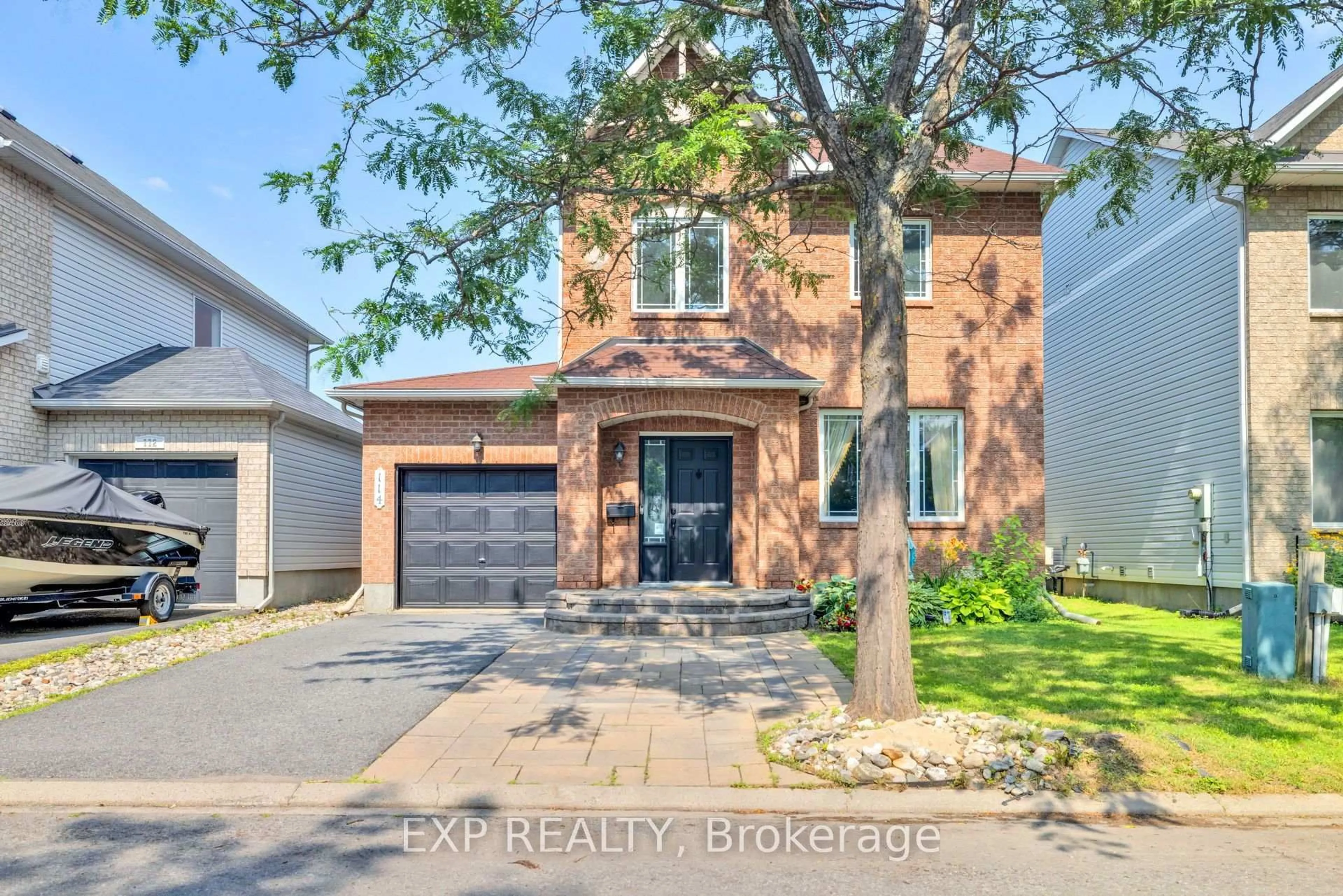 Home with brick exterior material, street for 114 Ashmore Dr, Barrhaven Ontario K2G 7B3
