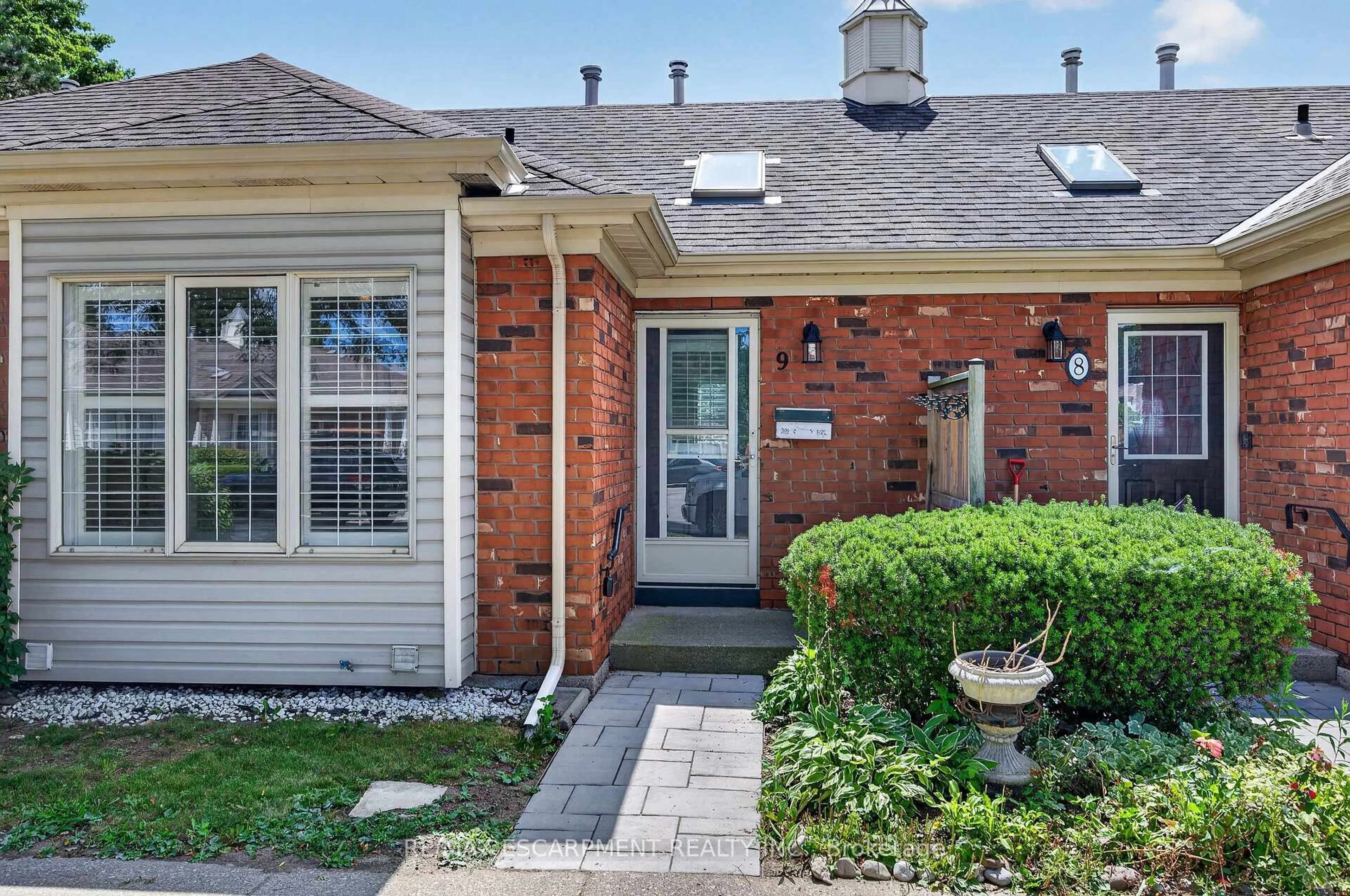 Home with brick exterior material, street for 175 Fiddlers Green Rd #9, Hamilton Ontario L9G 4X7