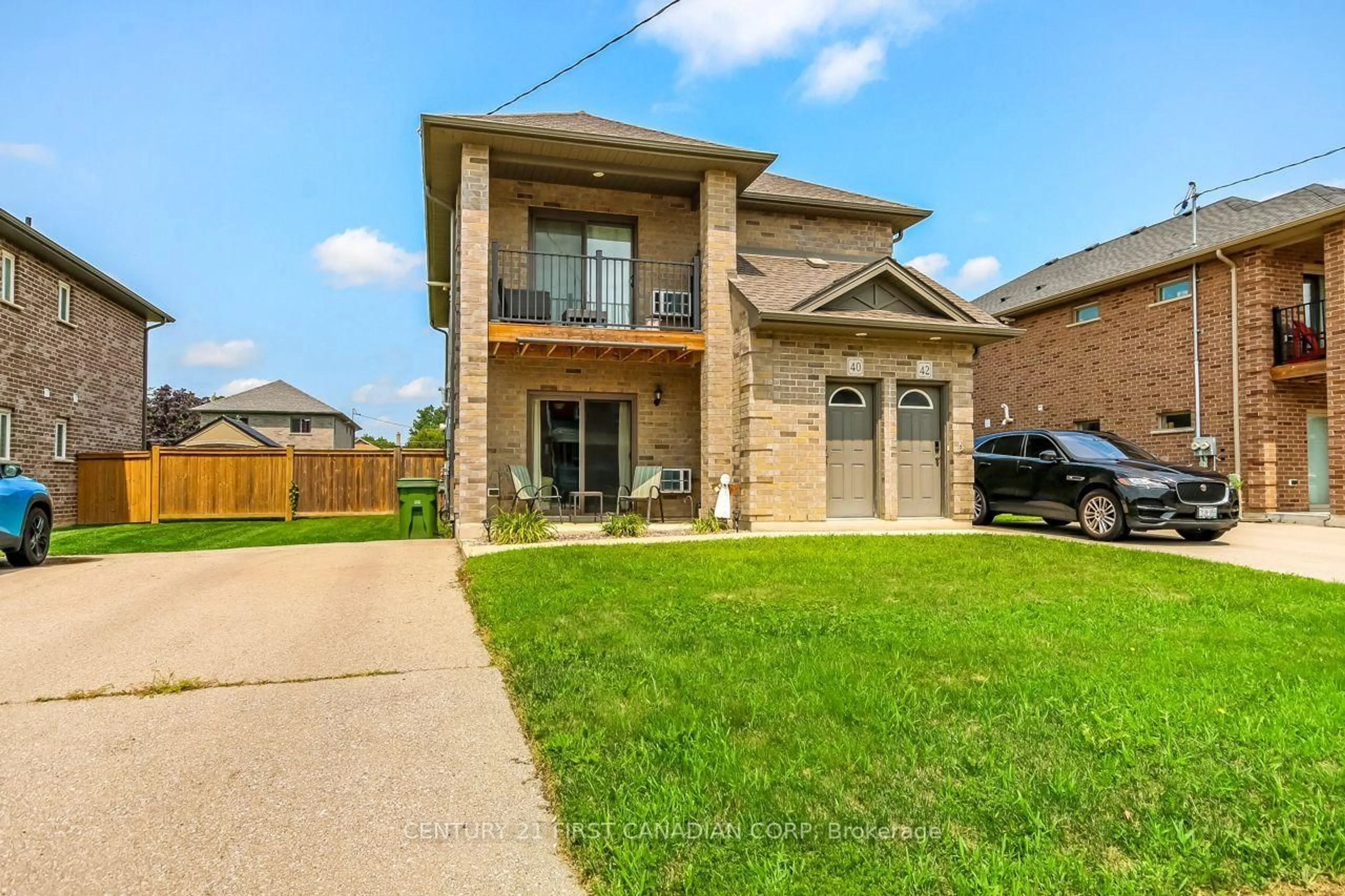 Home with brick exterior material, street for 40-42 Locust St, St. Thomas Ontario N5R 2C1