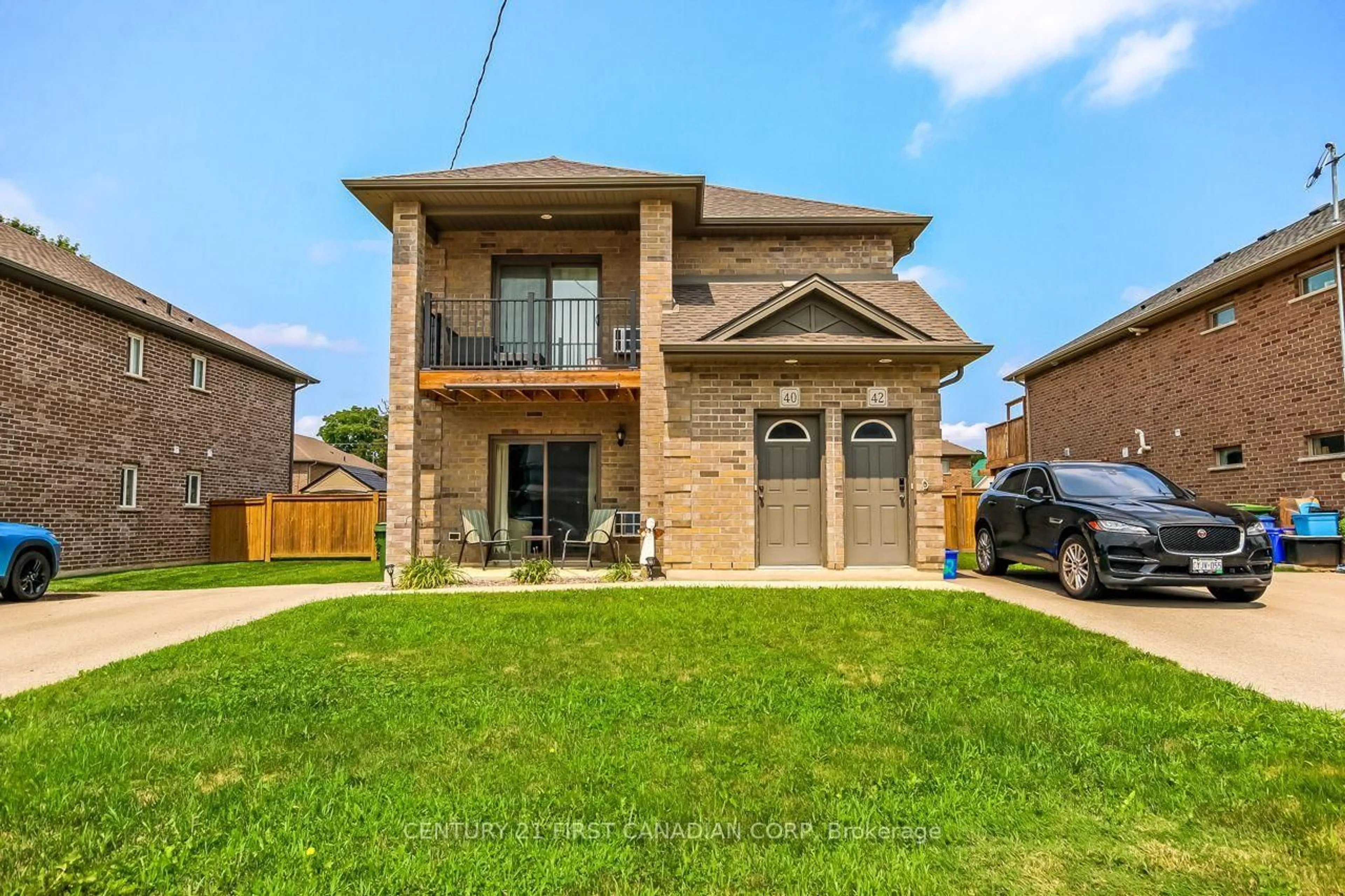 Home with brick exterior material, street for 40-42 Locust St, St. Thomas Ontario N5R 2C1