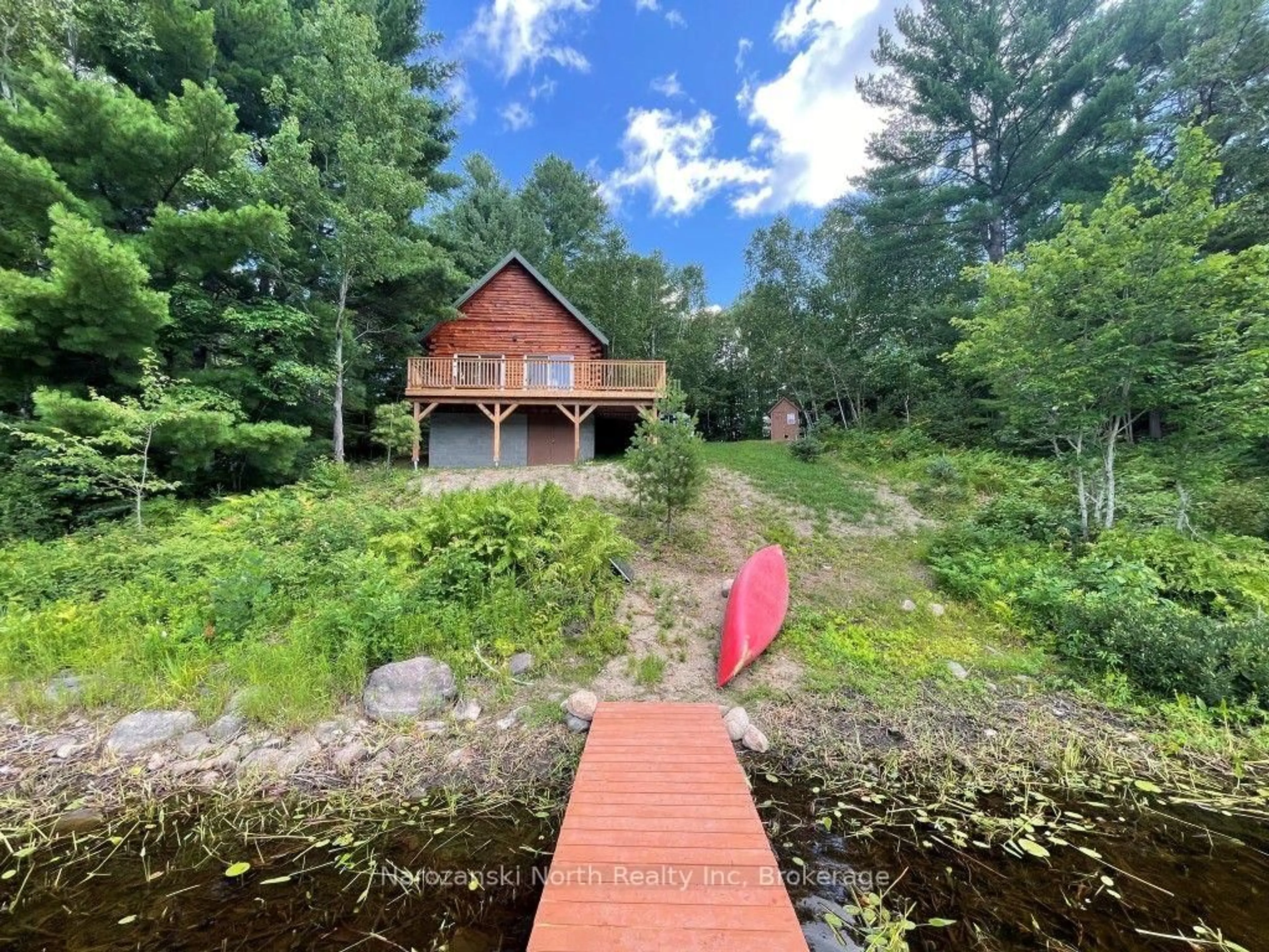 A pic from outside/outdoor area/front of a property/back of a property/a pic from drone, water/lake/river/ocean view for 1020 Dry Rapid Rd, French River Ontario P0M 1A0