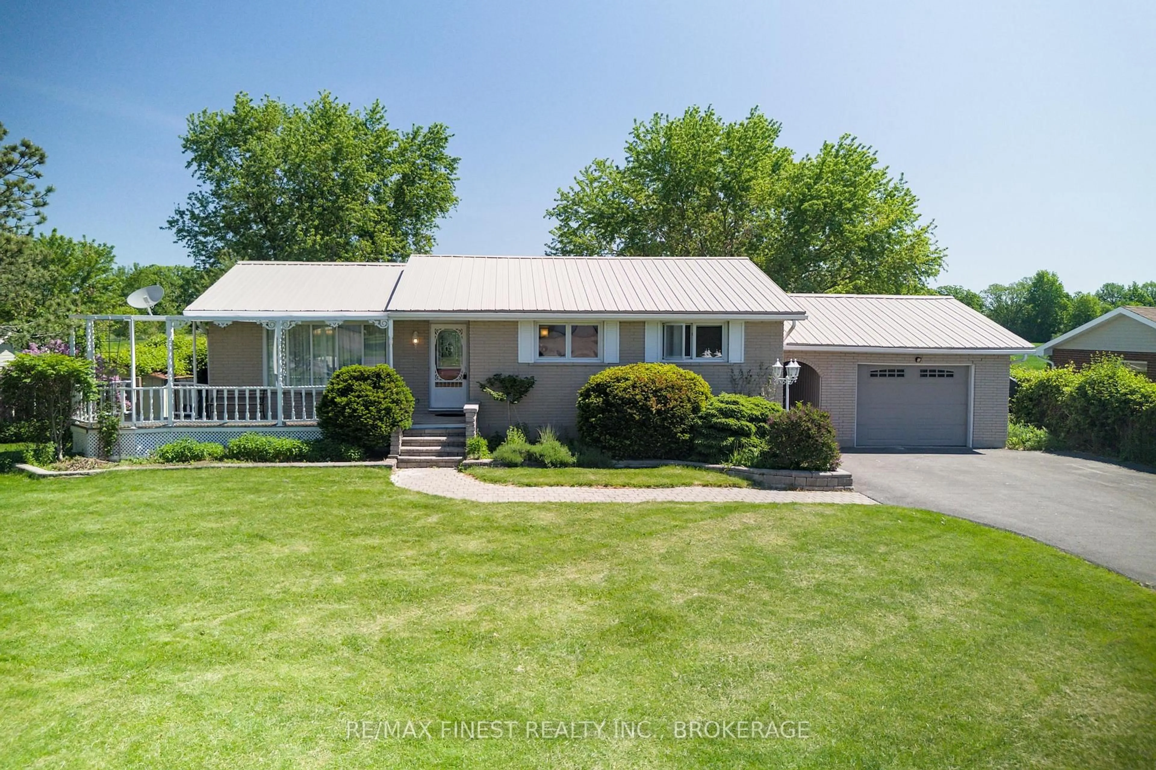 A pic from outside/outdoor area/front of a property/back of a property/a pic from drone, street for 301 County Rd 8, Napanee Ontario K7R 3K6