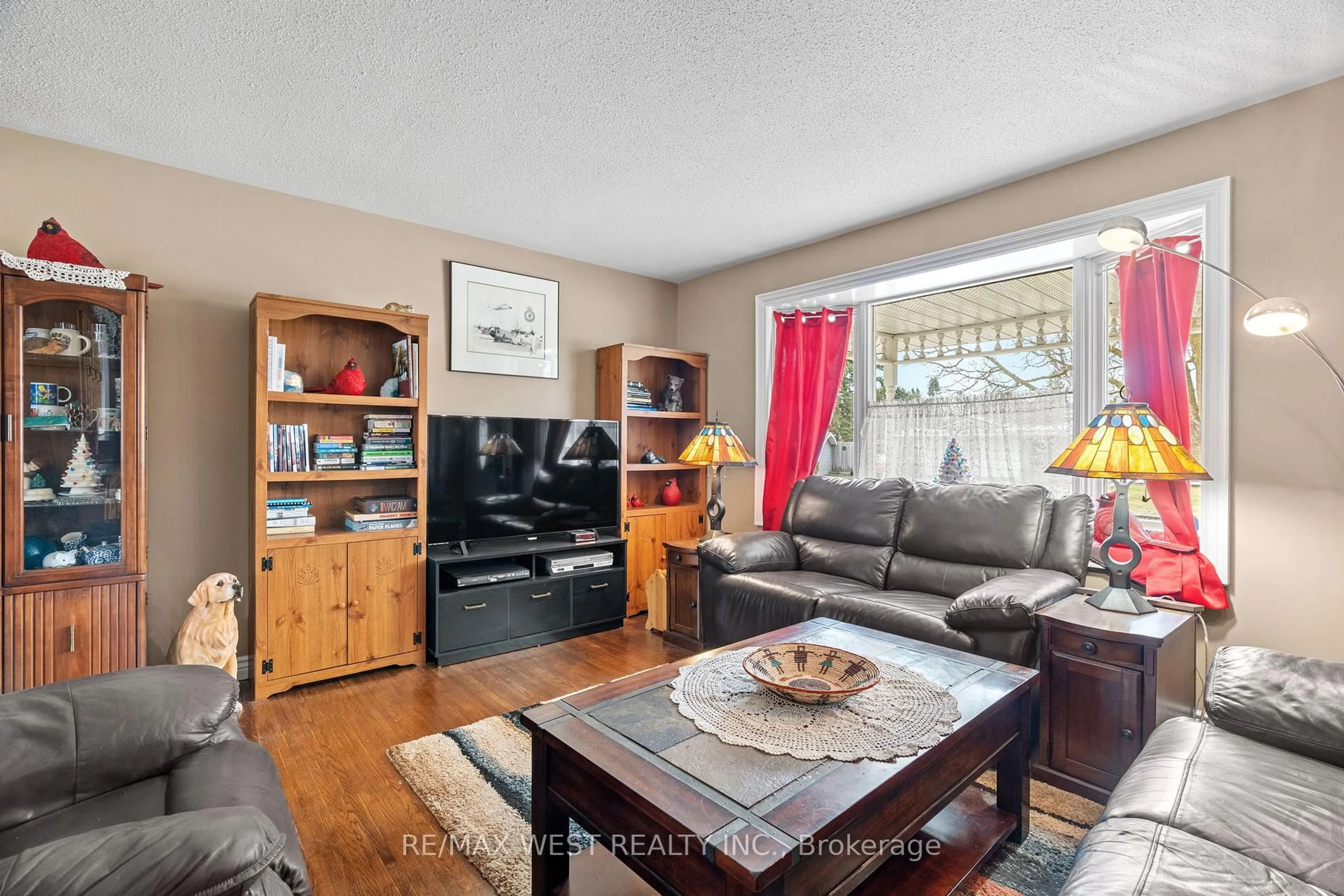 Living room with furniture, wood/laminate floor for 96 Langford Dr, Lucan Biddulph Ontario N0M 2J0