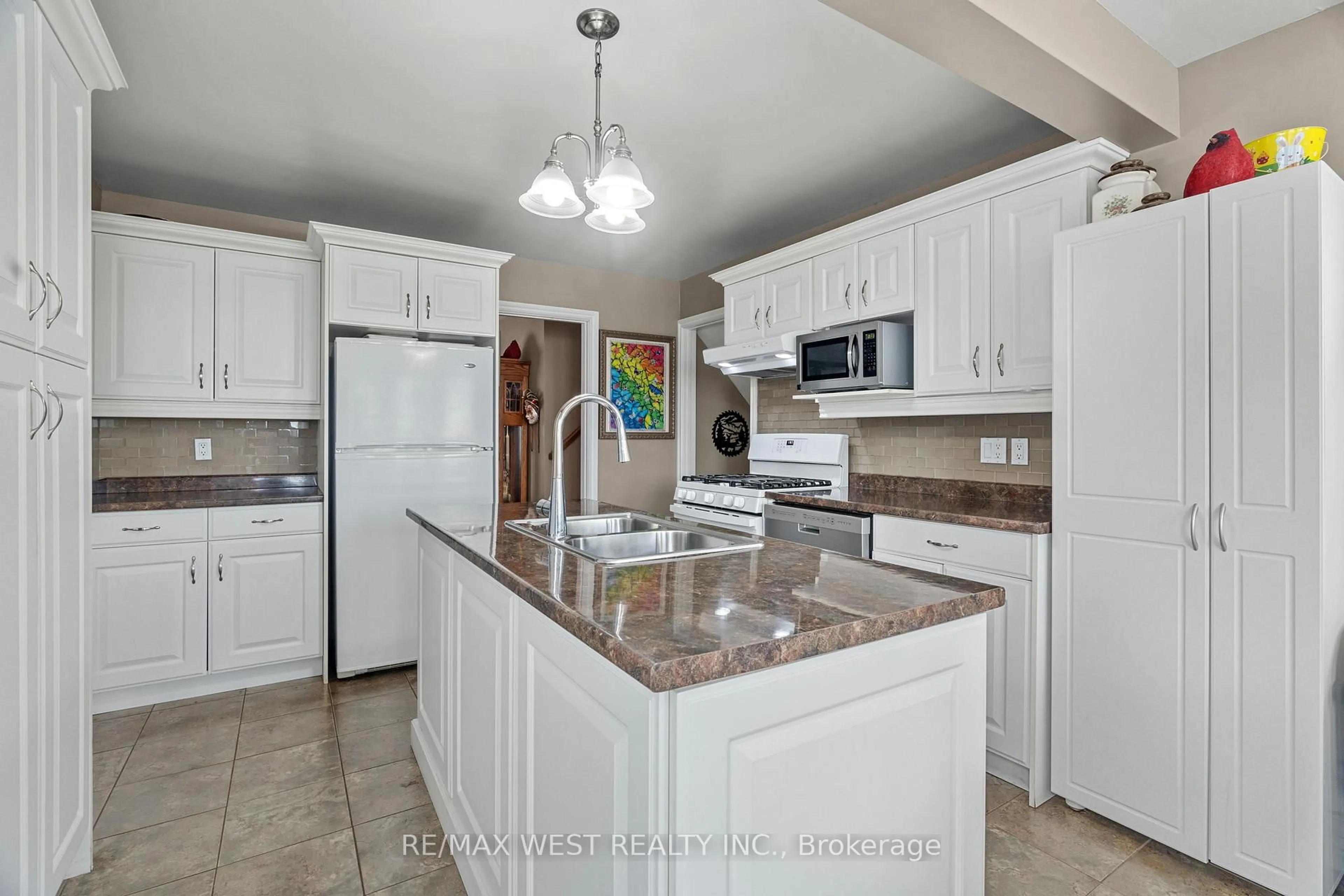 Open concept kitchen, ceramic/tile floor for 96 Langford Dr, Lucan Biddulph Ontario N0M 2J0