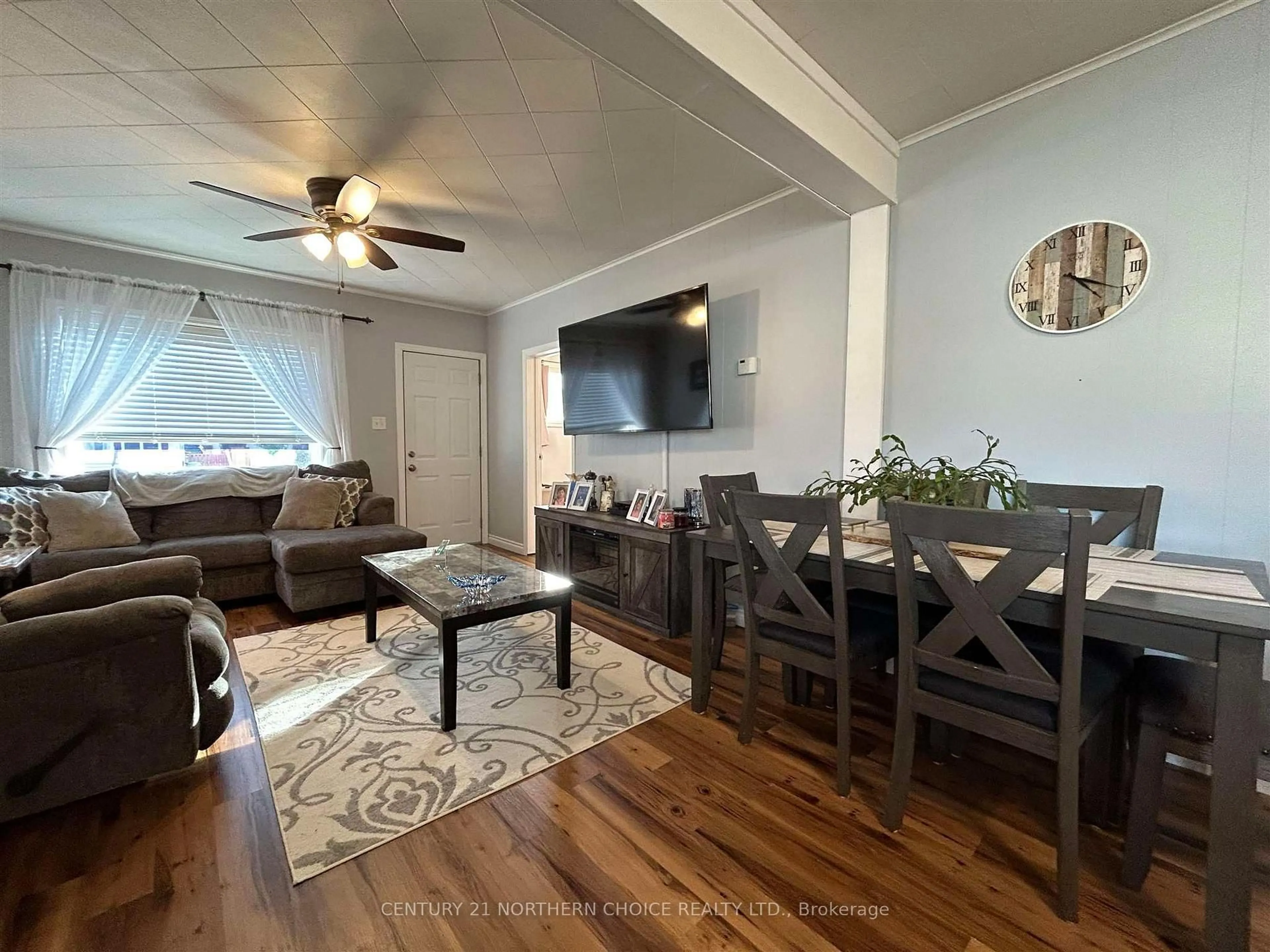Living room with furniture, wood/laminate floor for 628 Second St, Fort Frances Ontario P9A 1N5