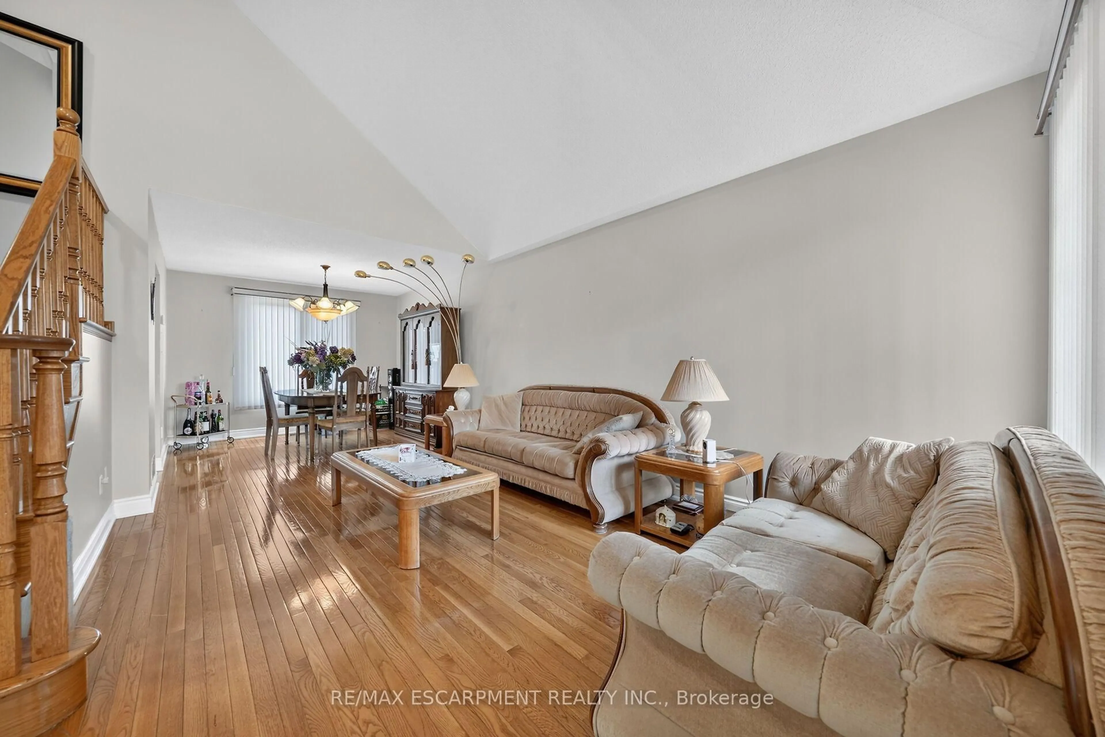 Living room with furniture, wood/laminate floor for 42 Hillgarden Dr, Hamilton Ontario L8J 3R3
