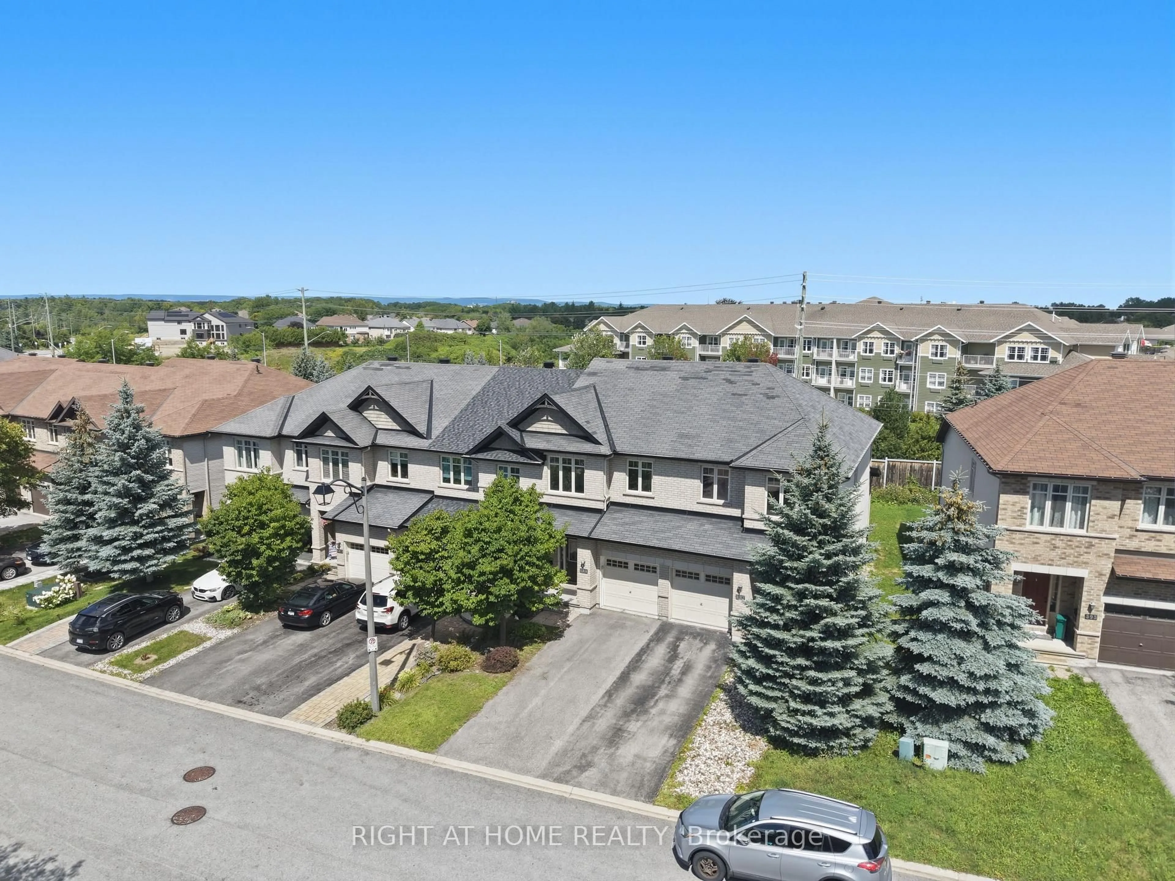 A pic from outside/outdoor area/front of a property/back of a property/a pic from drone, mountain view for 599 Remnor Ave, Ottawa Ontario K2T 0A6