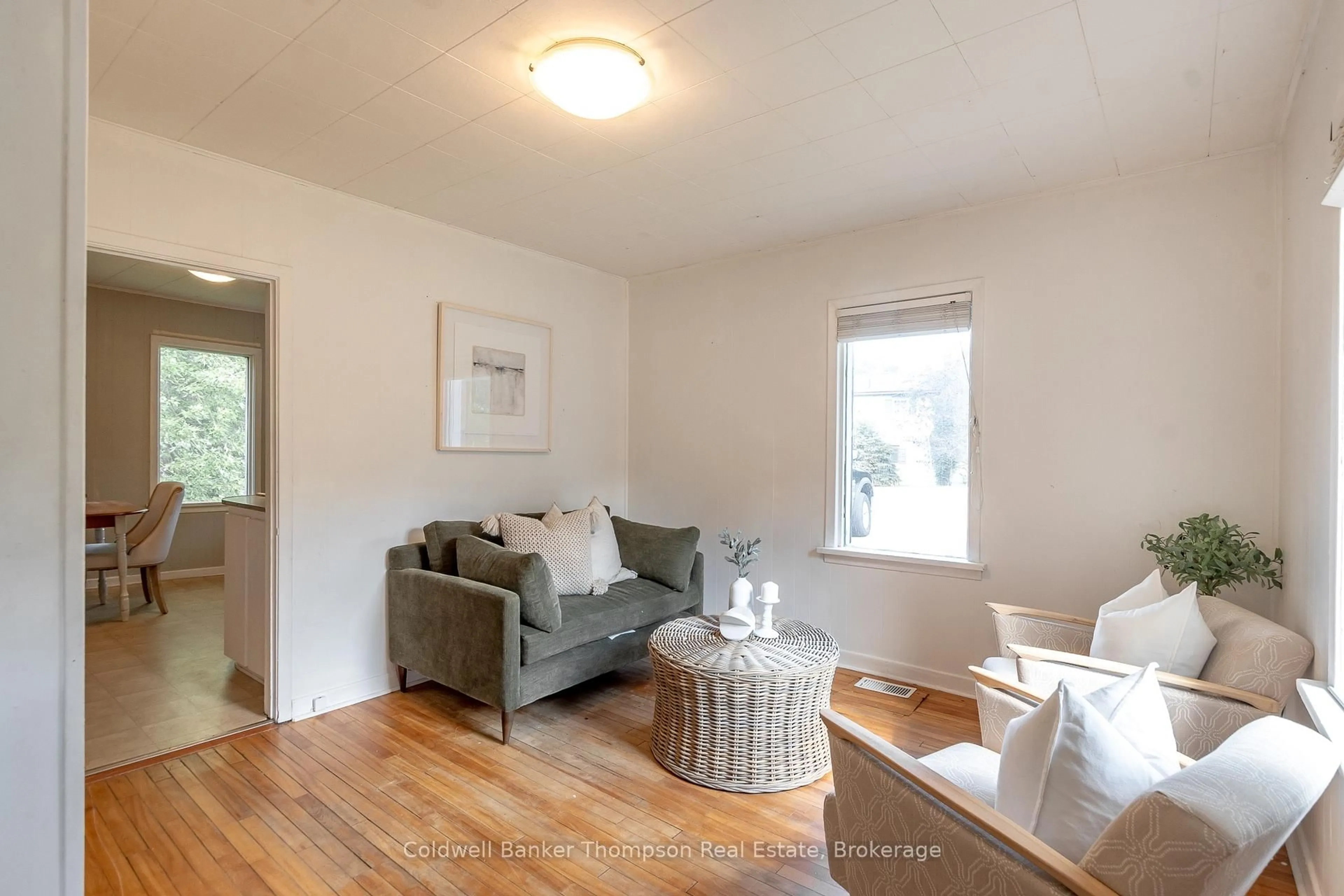 Living room with furniture, wood/laminate floor for 60 West Rd, Huntsville Ontario P1H 1L8