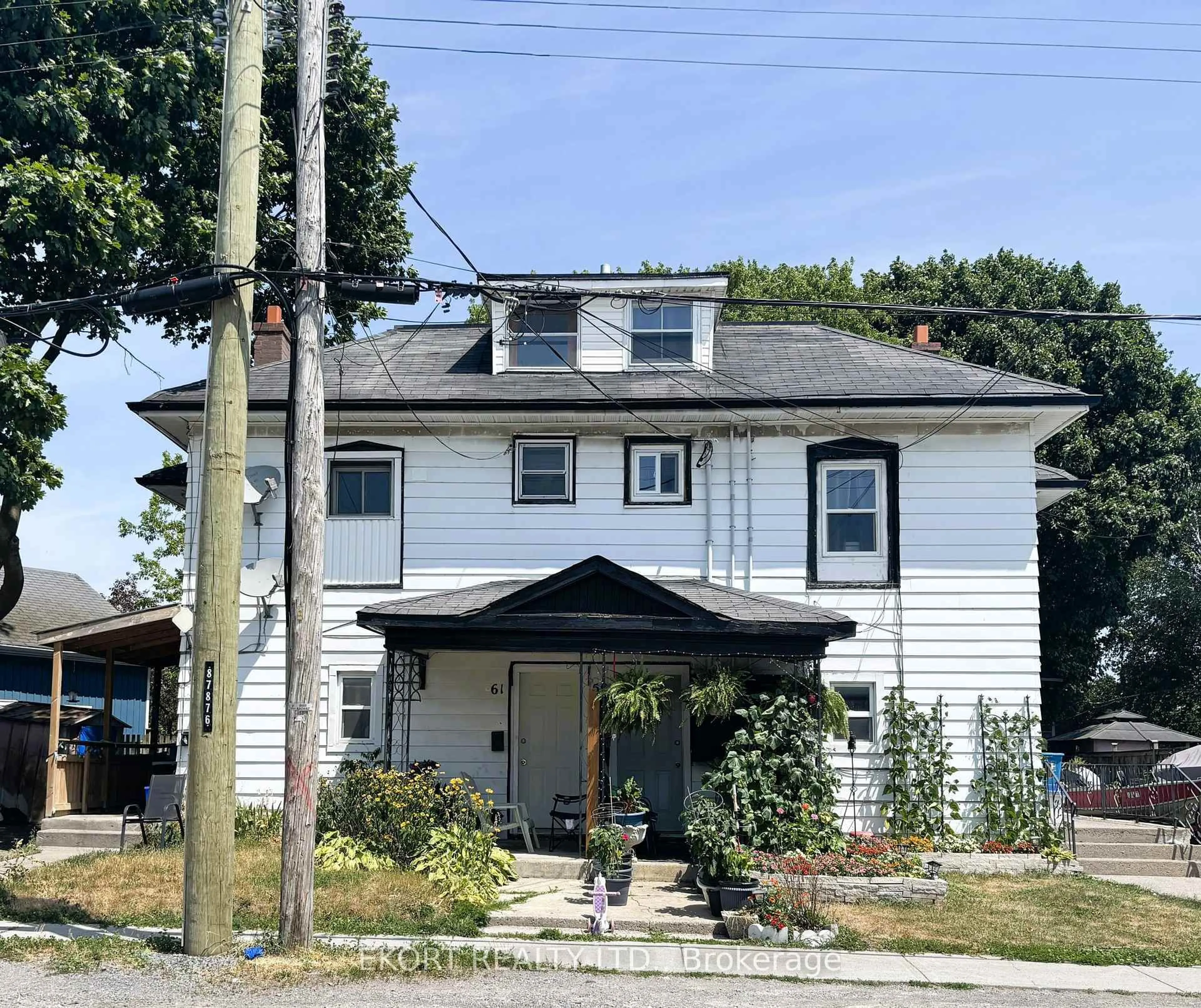 Home with vinyl exterior material, street for 59-61 St Charles St, Belleville Ontario K8P 2W1