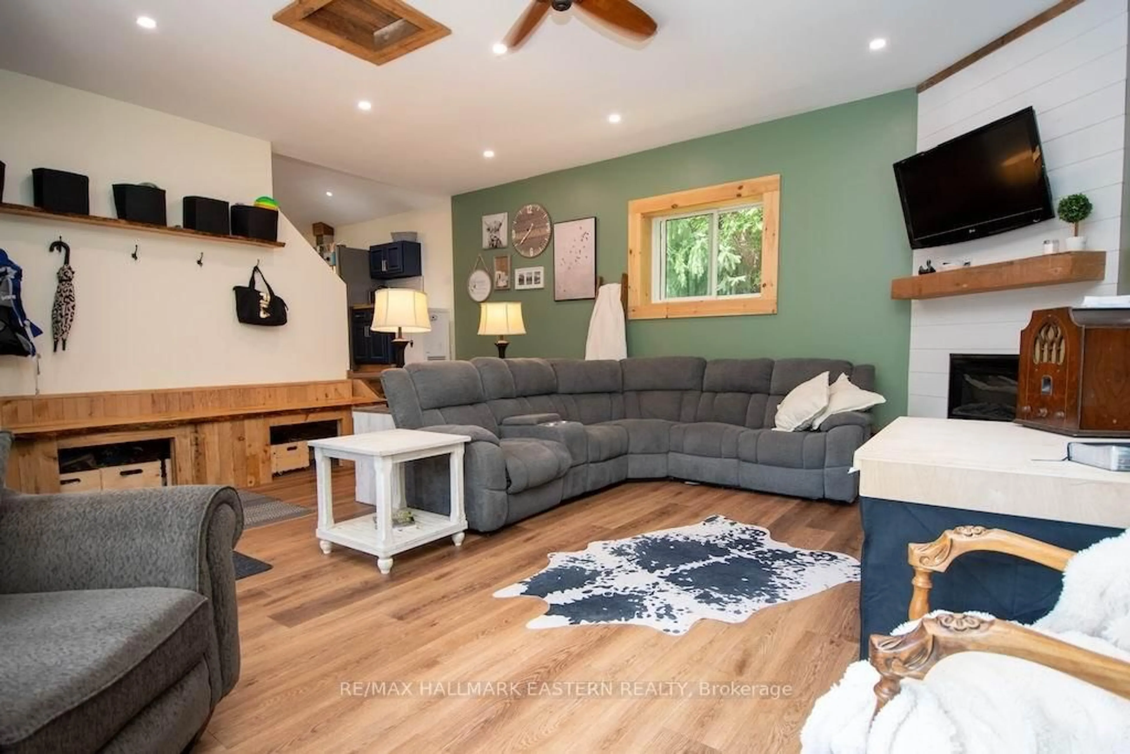 Living room with furniture, wood/laminate floor for 318 & 321 Caves Rd, Douro-Dummer Ontario K0L 3A0