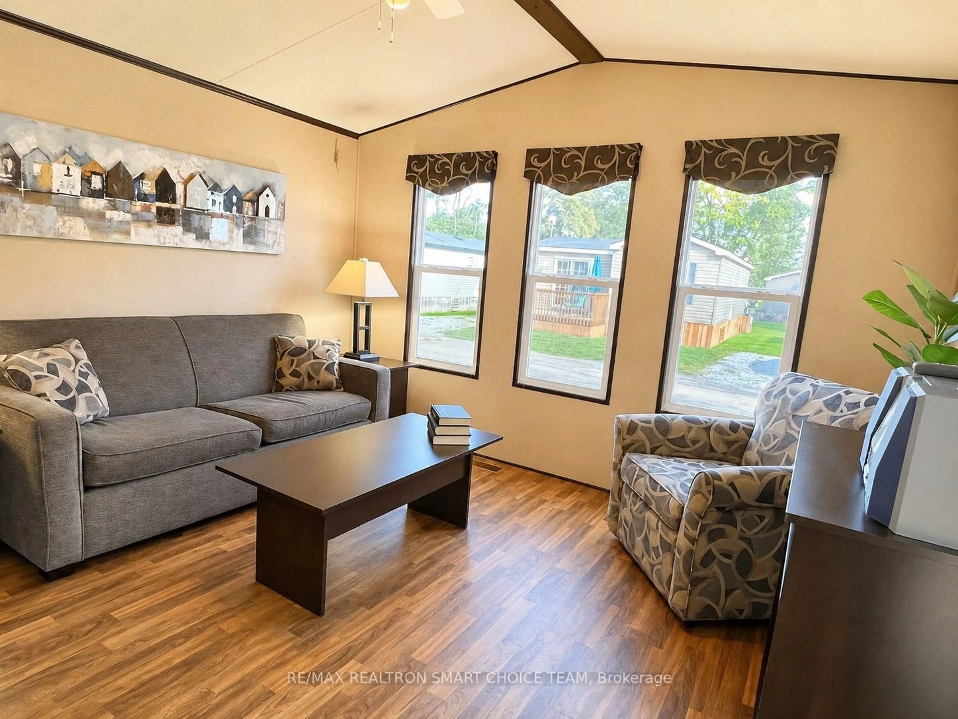 Living room with furniture, wood/laminate floor for 1501 Line 8 Rd #241, Niagara-on-the-Lake Ontario L0S 1J0