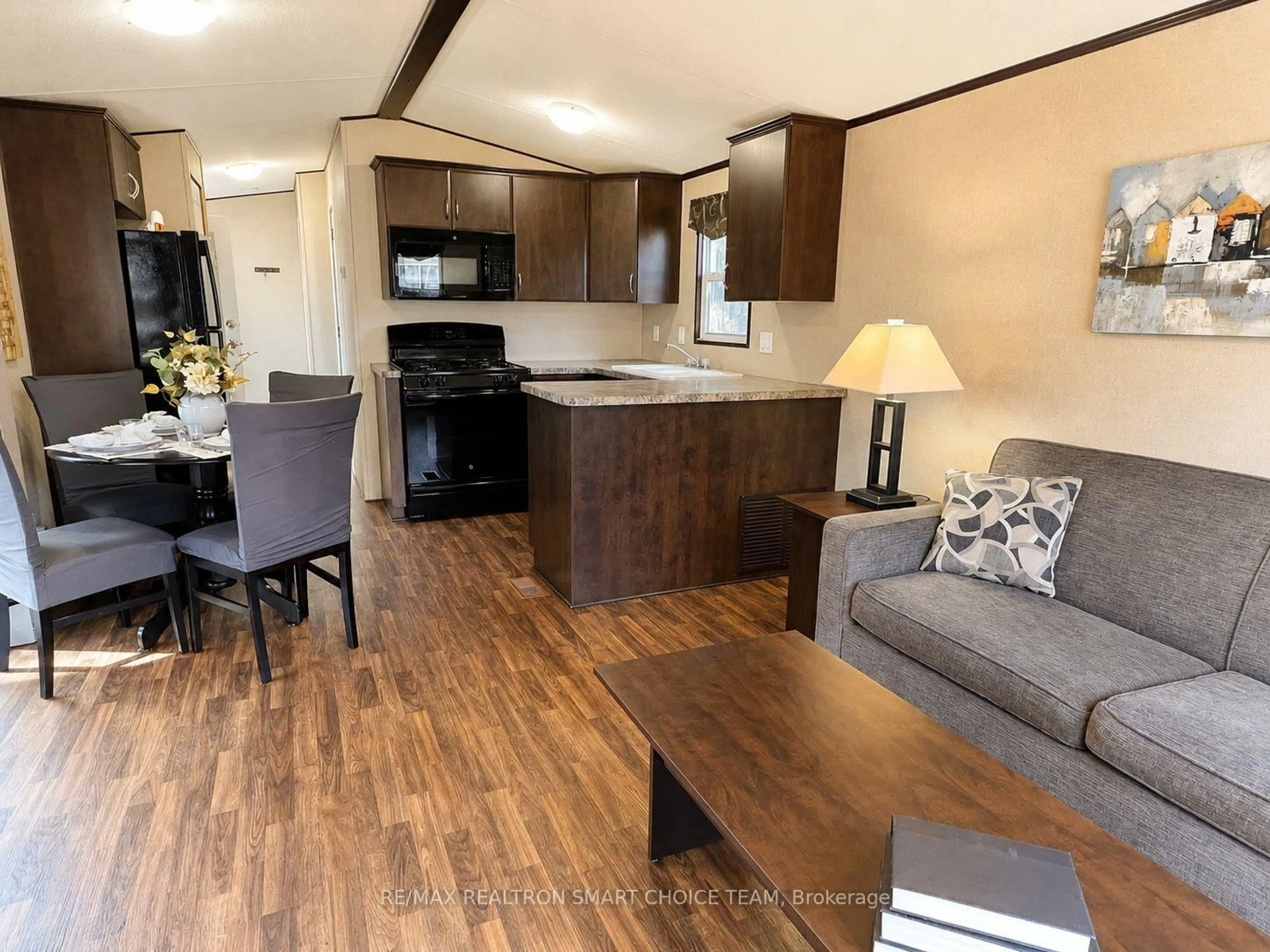 Open concept kitchen, wood/laminate floor for 1501 Line 8 Rd #241, Niagara-on-the-Lake Ontario L0S 1J0