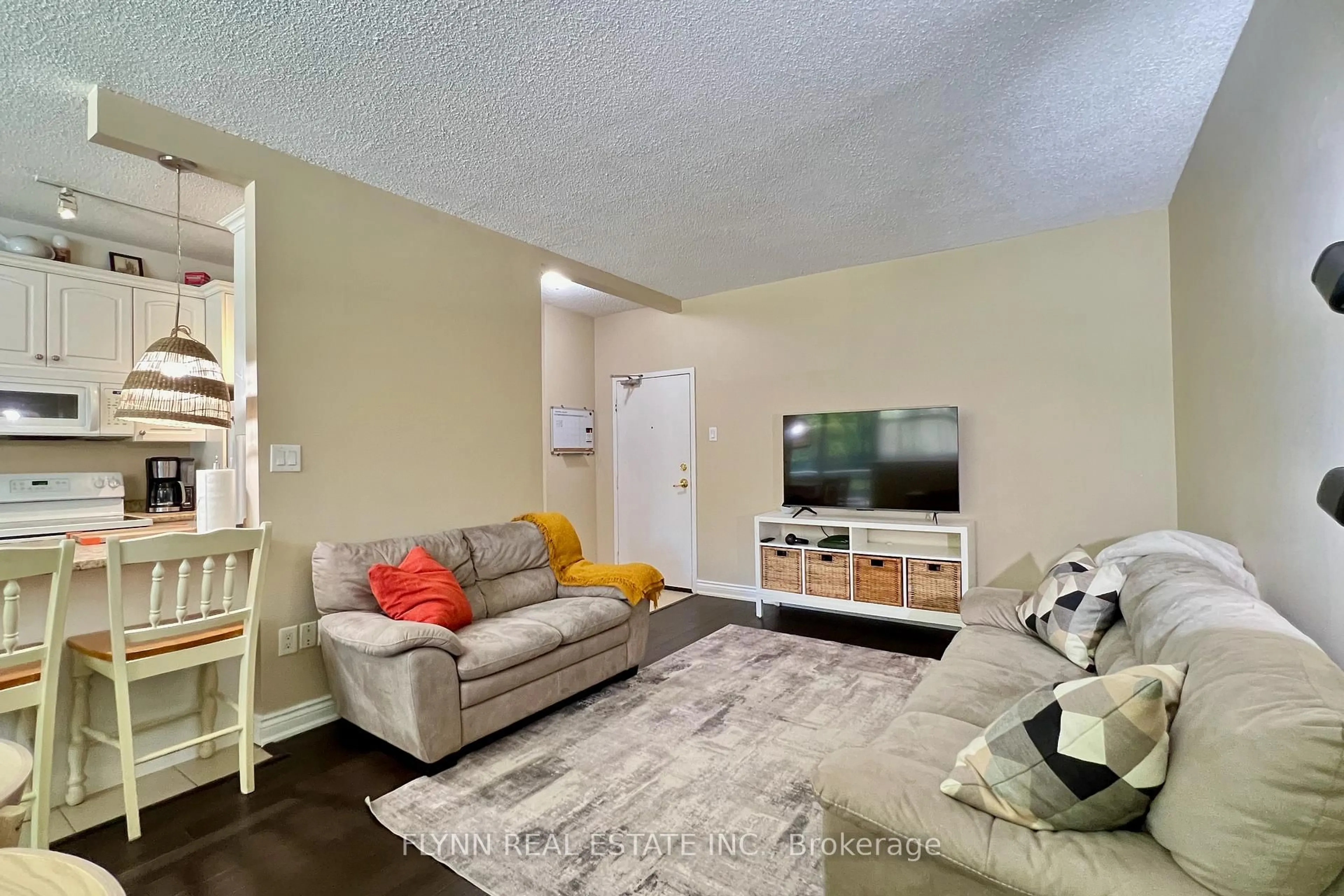 Living room with furniture, unknown for 6390 HUGGINS St #103, Niagara Falls Ontario L2J 1H1
