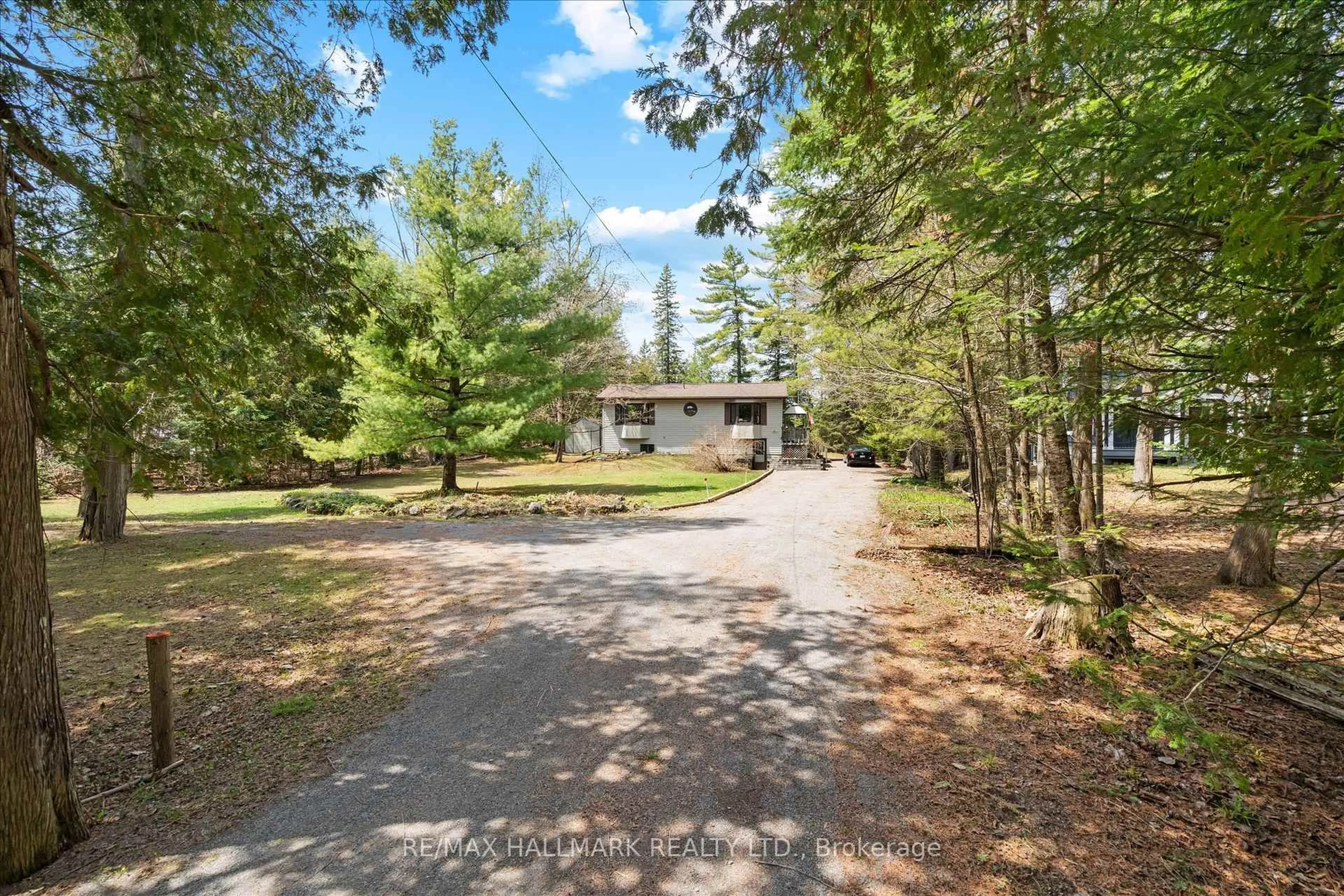 A pic from outside/outdoor area/front of a property/back of a property/a pic from drone, forest/trees view for 25 Little Silver Lake Way, Trent Lakes Ontario K0M 1A0