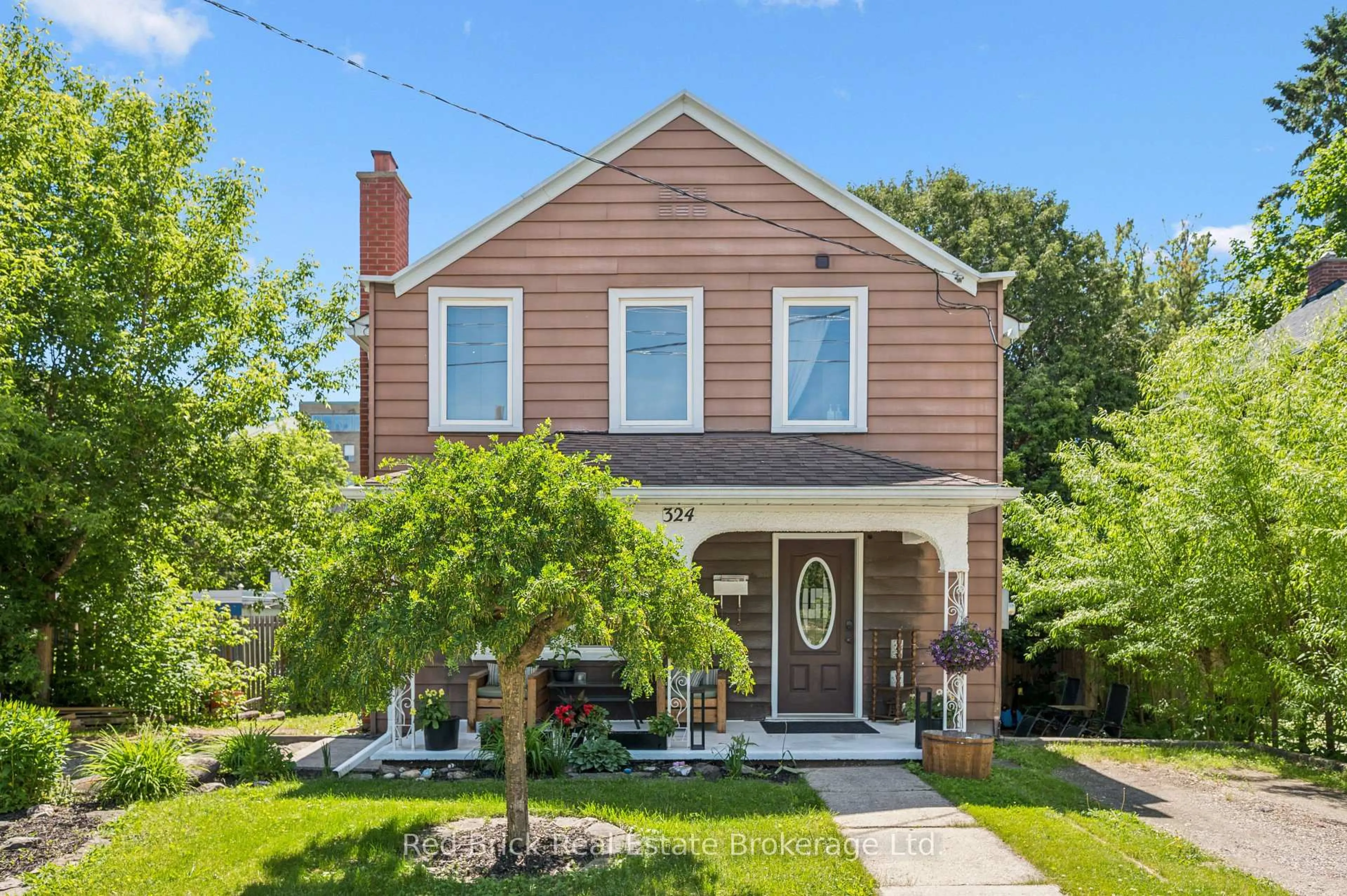 Home with brick exterior material, street for 324 Waterloo Ave, Guelph Ontario N1H 3J8
