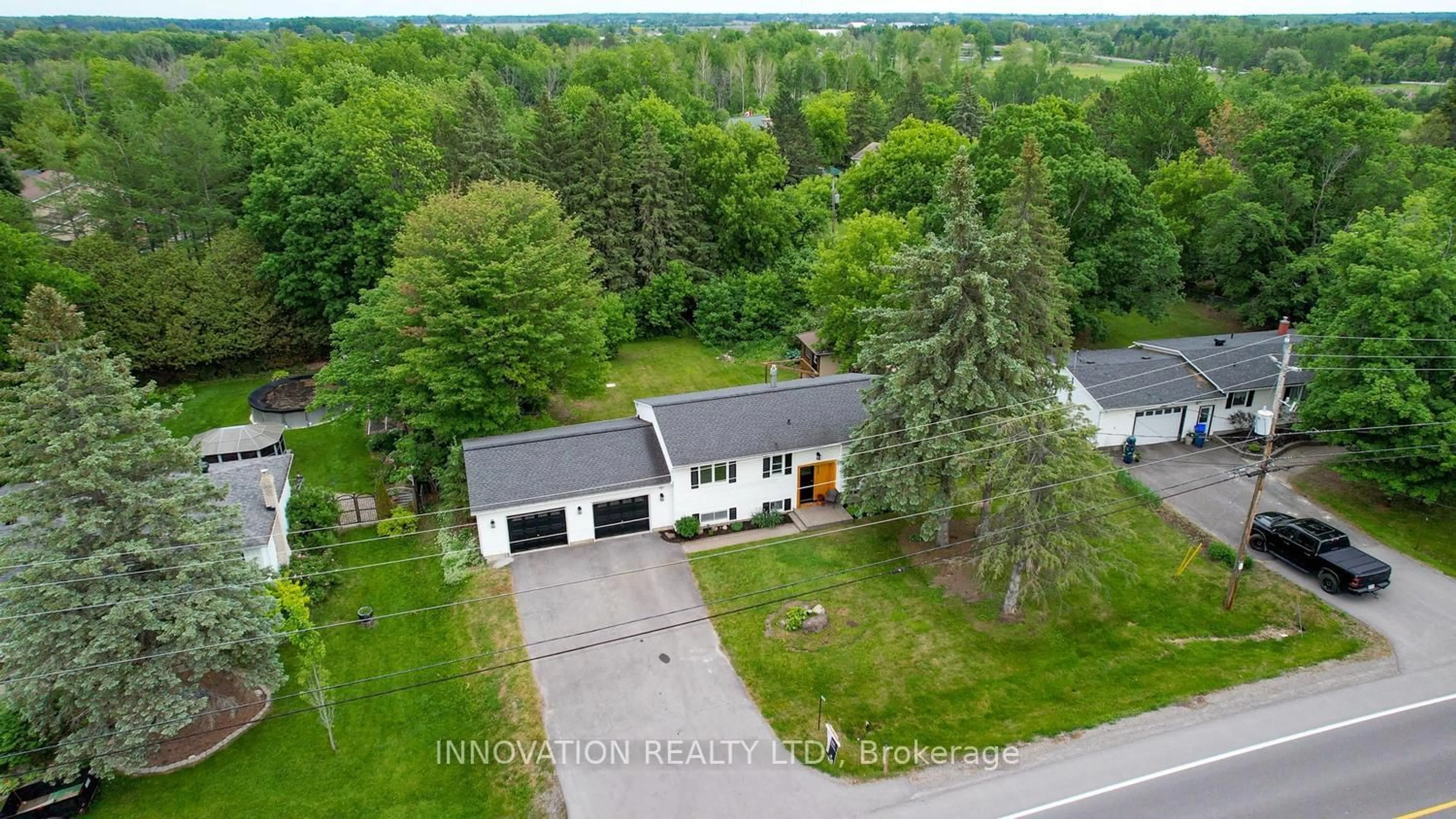 A pic from outside/outdoor area/front of a property/back of a property/a pic from drone, street for 6535 Rideau Valley Dr, Manotick Ontario K4M 1B3