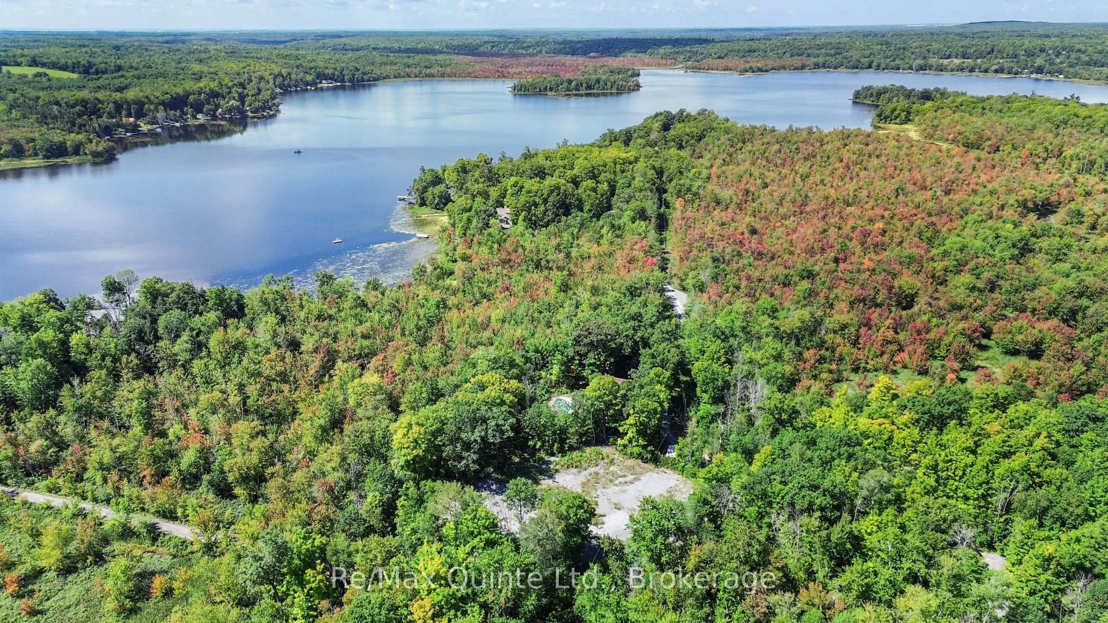 A pic from outside/outdoor area/front of a property/back of a property/a pic from drone, water/lake/river/ocean view for 49 North Shore Lane, Madoc Ontario K0K 2K0