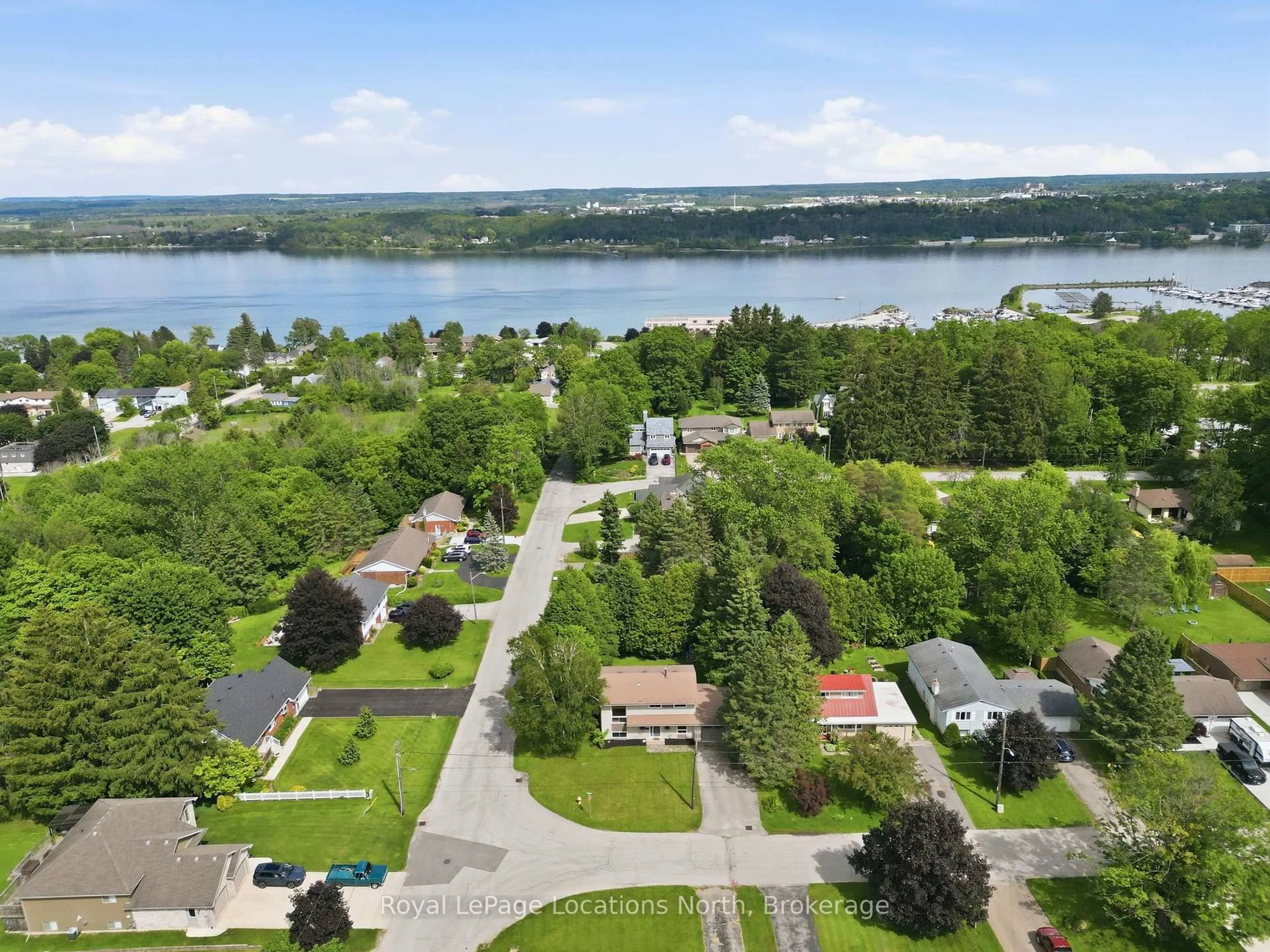 A pic from outside/outdoor area/front of a property/back of a property/a pic from drone, water/lake/river/ocean view for 2595 6th Ave, Owen Sound Ontario N4K 5J7