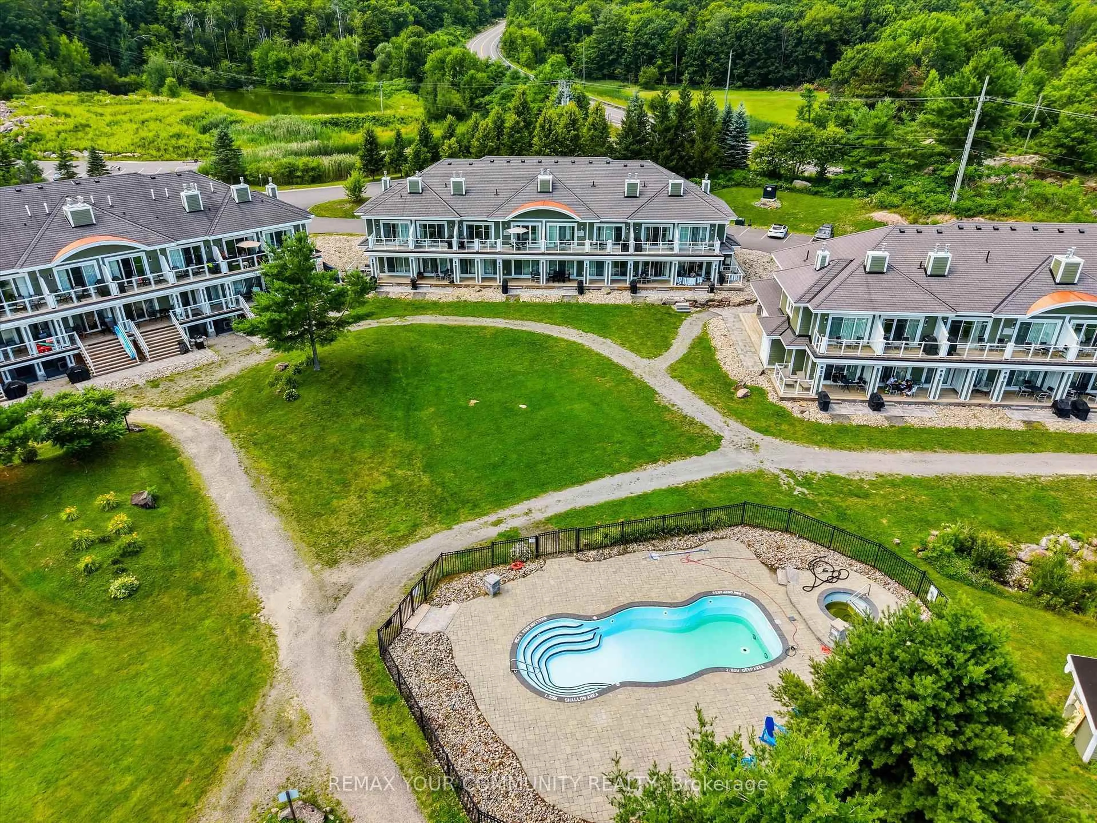 A pic from outside/outdoor area/front of a property/back of a property/a pic from drone, water/lake/river/ocean view for 1869 Muskoka Road 118 #BHV-B-105, Muskoka Lakes Ontario P1L 1W8