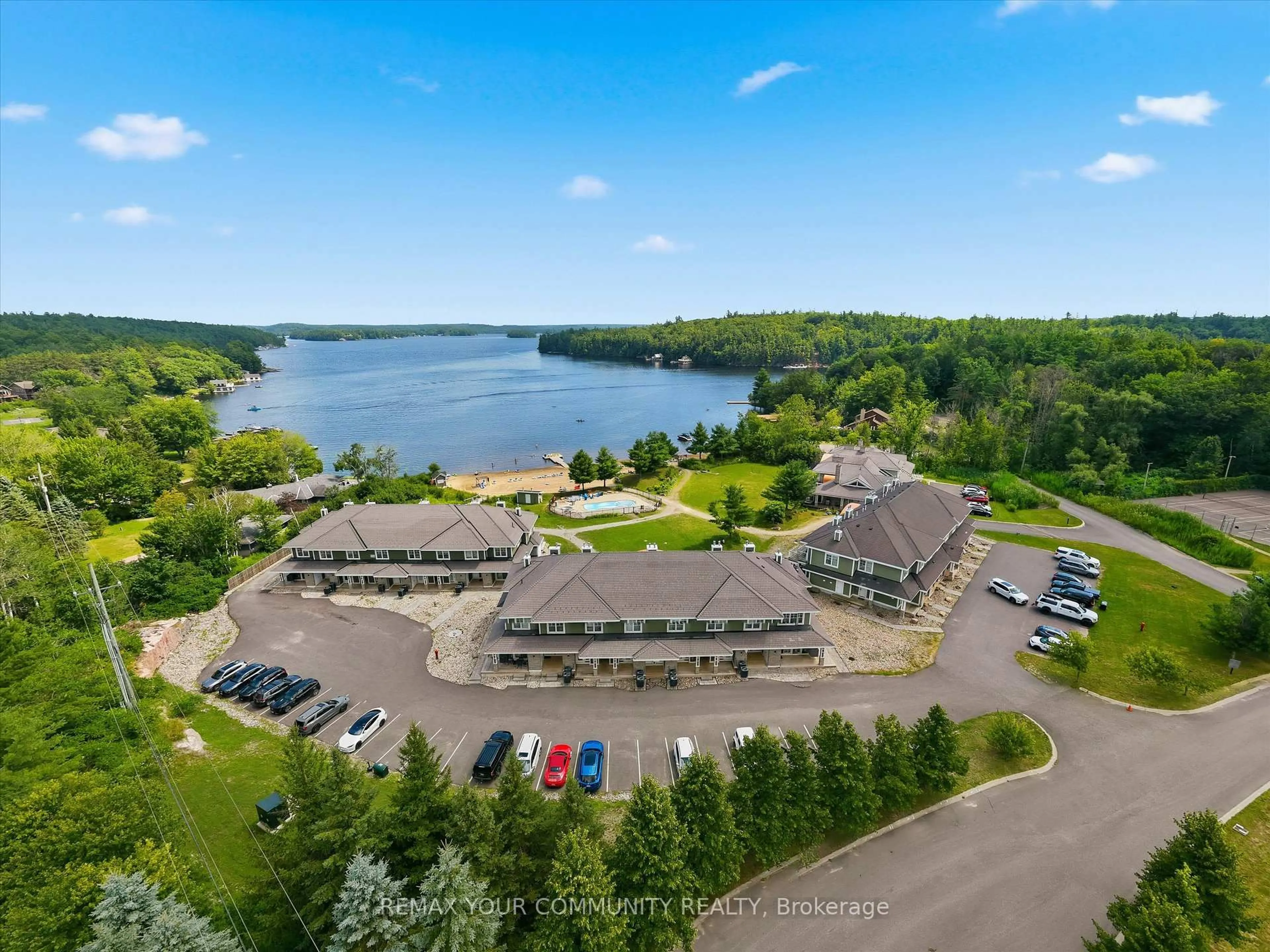 A pic from outside/outdoor area/front of a property/back of a property/a pic from drone, water/lake/river/ocean view for 1869 Muskoka Road 118 #BHV-B-105, Muskoka Lakes Ontario P1L 1W8