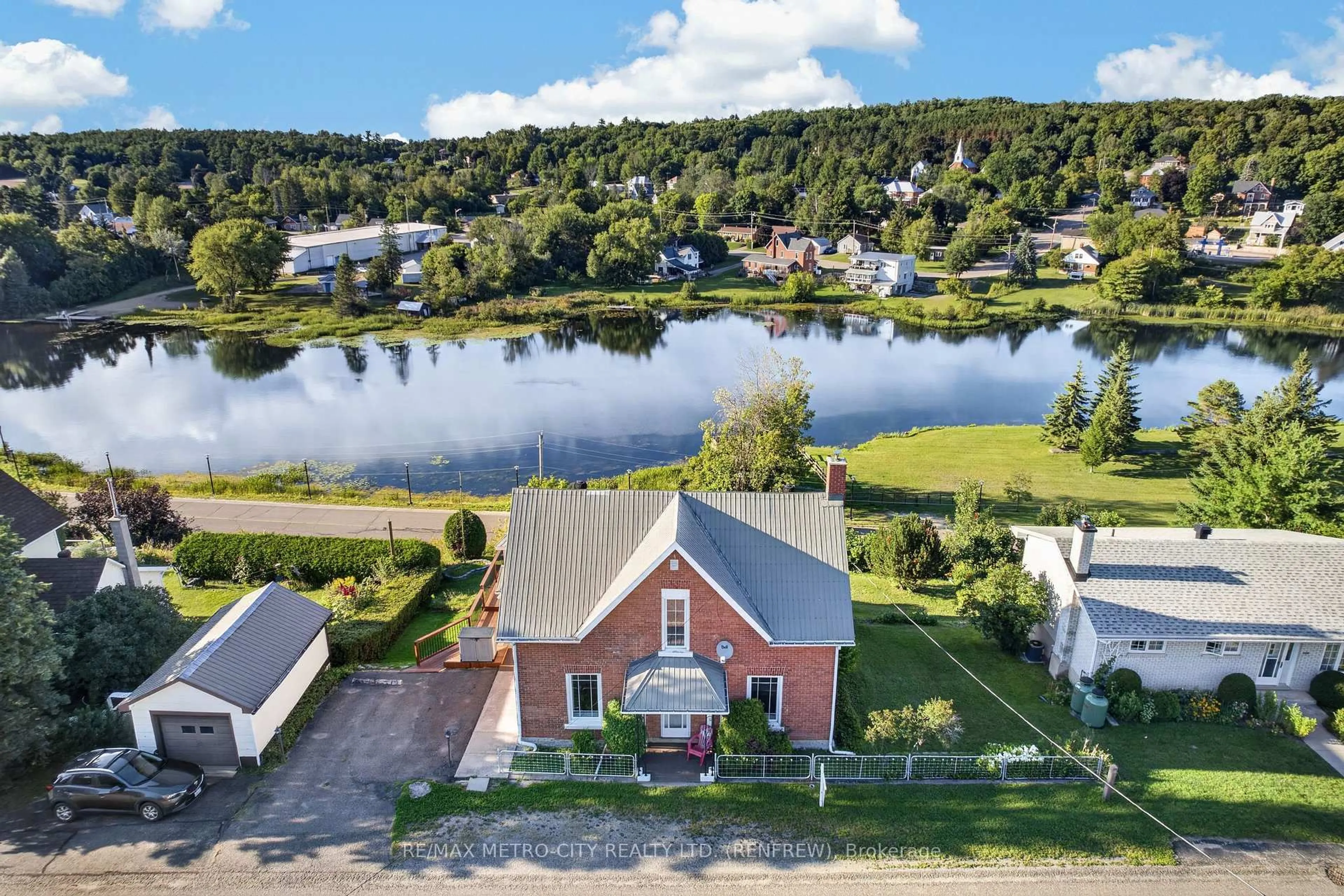 A pic from outside/outdoor area/front of a property/back of a property/a pic from drone, water/lake/river/ocean view for 293 Queen St, Eganville Ontario K0J 1T0