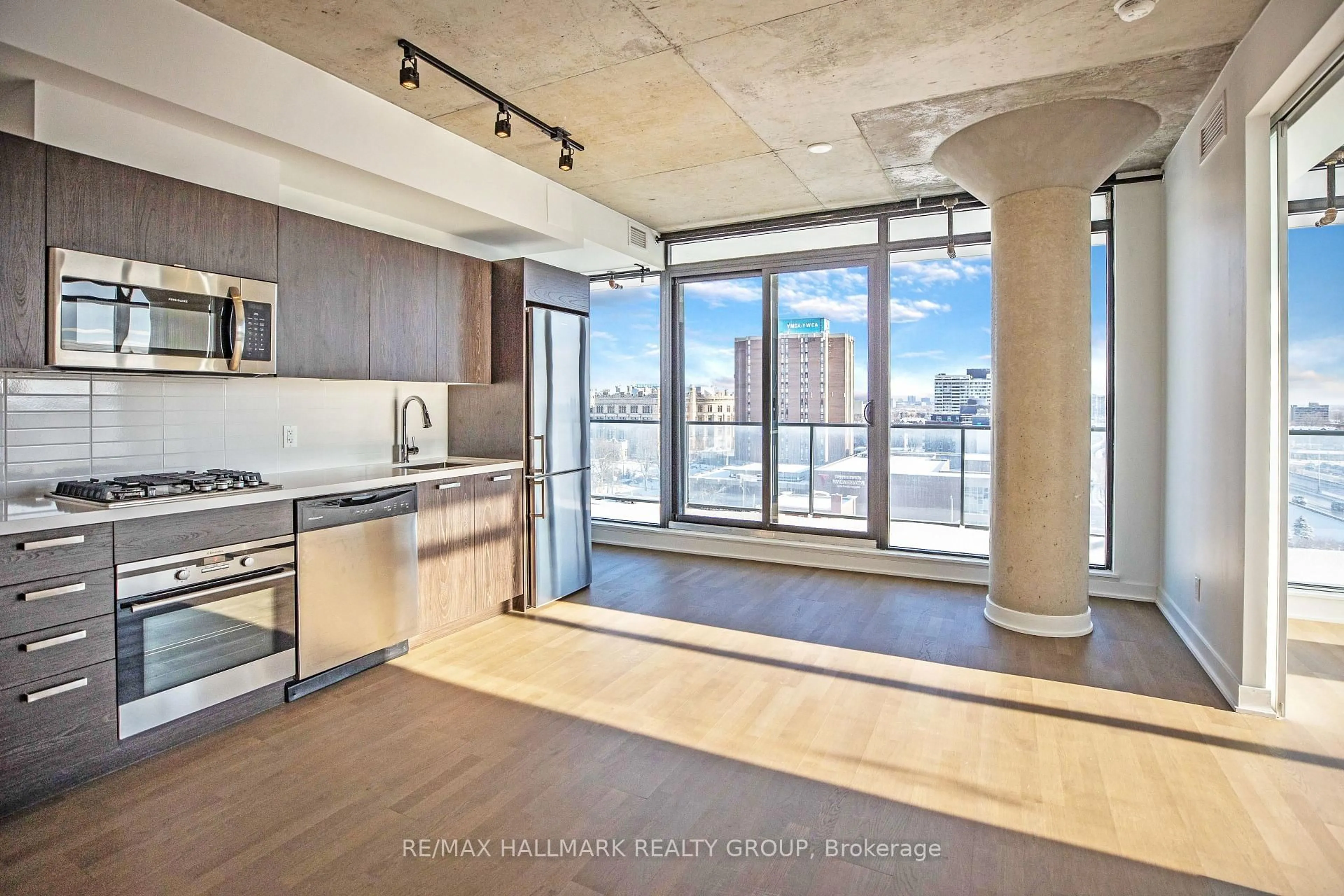Open concept kitchen, cement floor for 203 CATHERINE St #902, Ottawa Ontario K2P 1J5