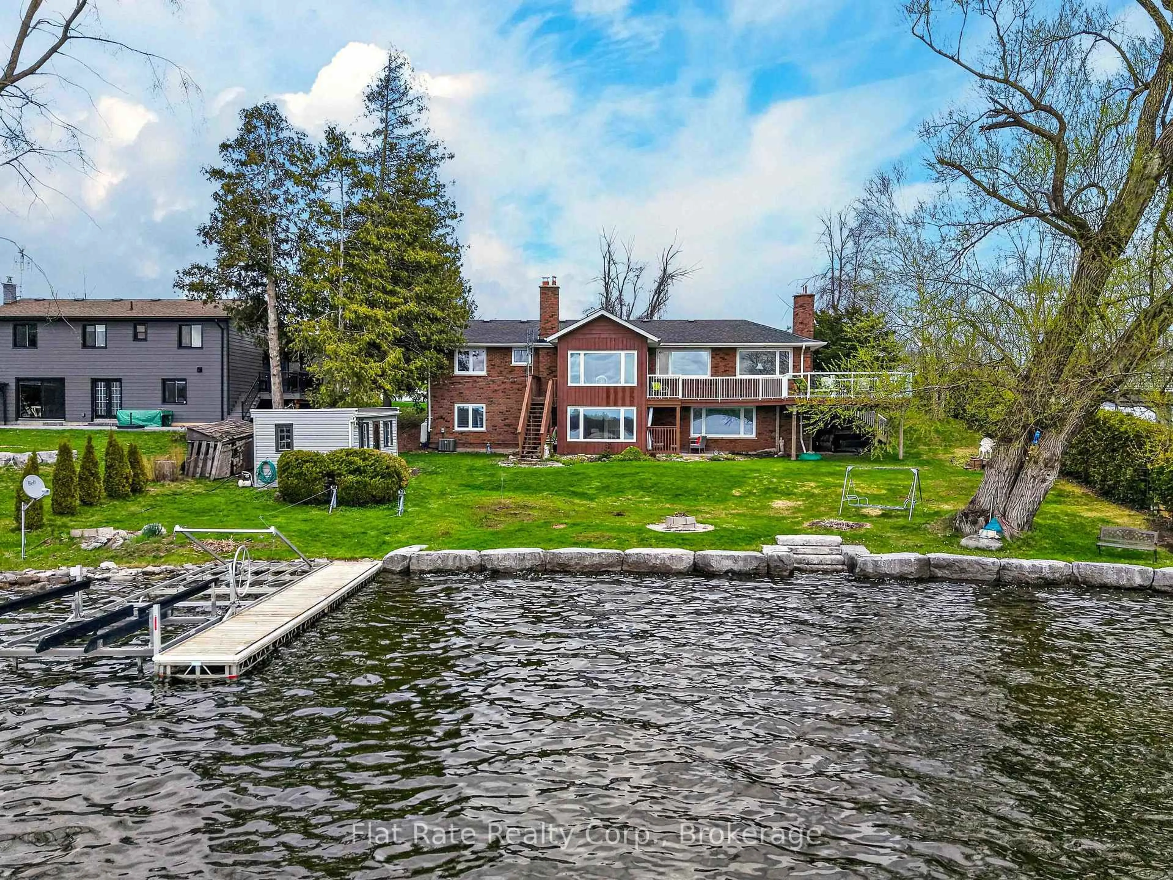 A pic from outside/outdoor area/front of a property/back of a property/a pic from drone, water/lake/river/ocean view for 1927 Pinehurst Ave, Selwyn Ontario K0L 2H0