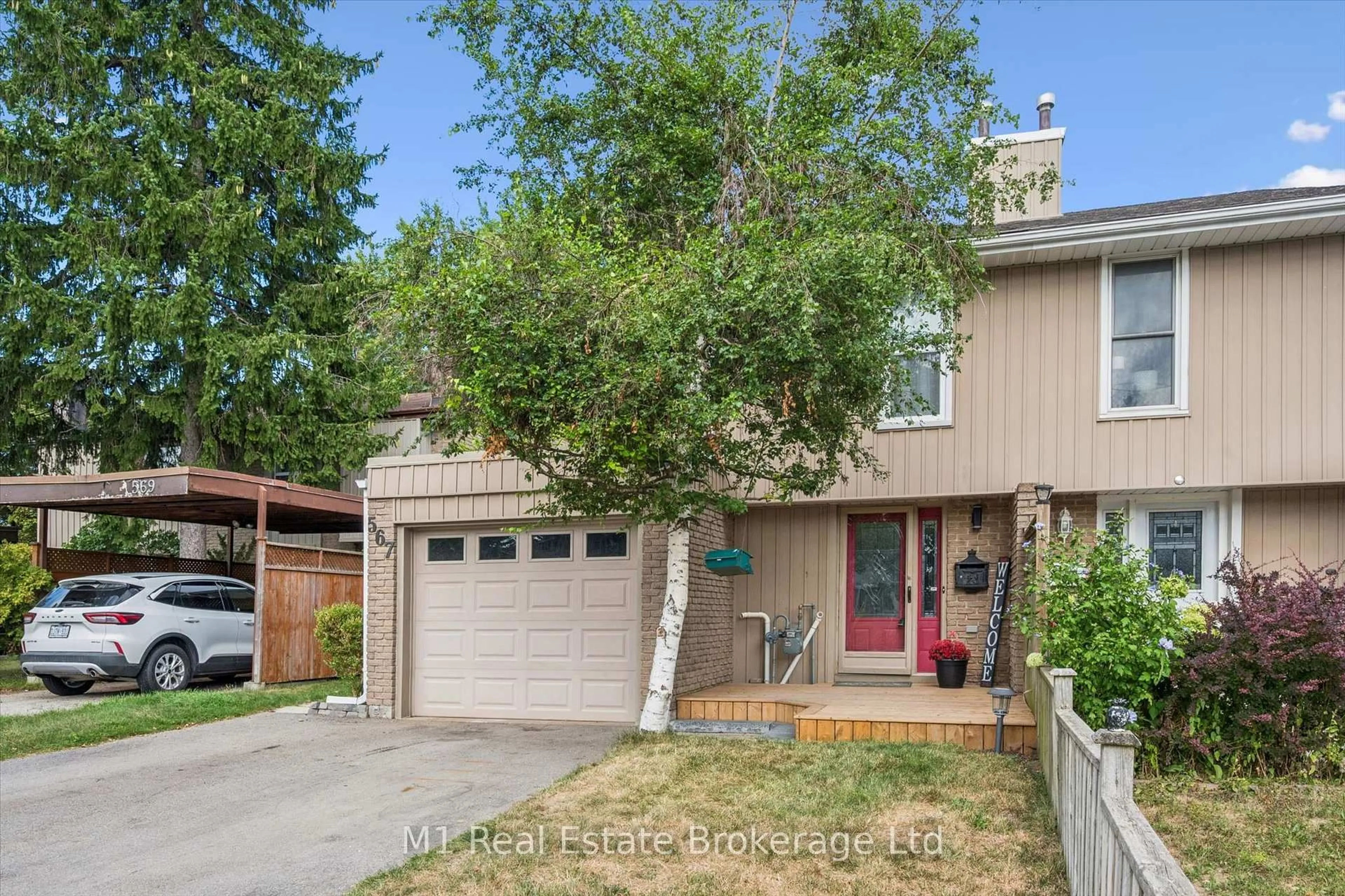 Home with vinyl exterior material, street for 567 Willow Rd, Guelph Ontario N1H 7H3