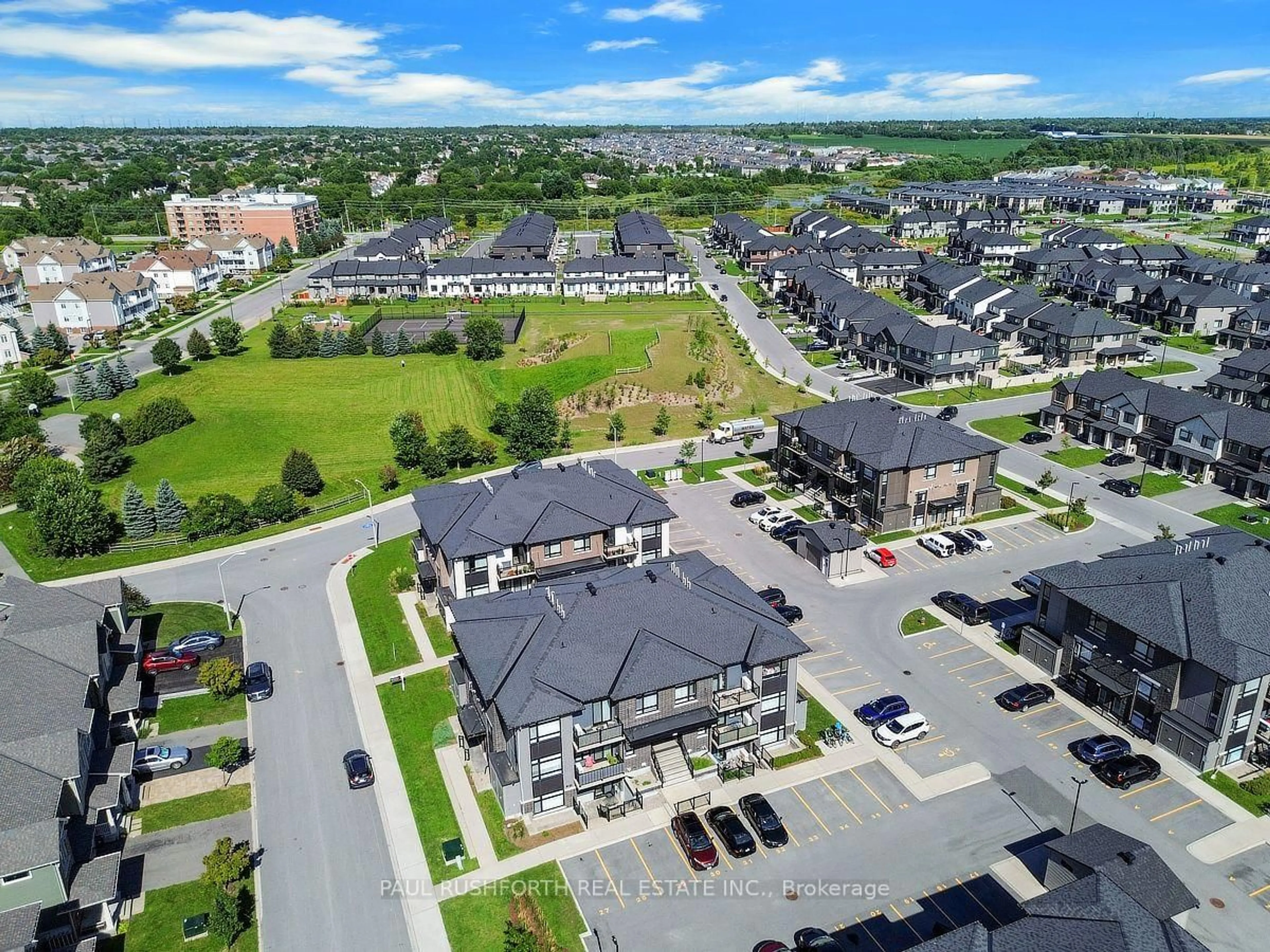 A pic from outside/outdoor area/front of a property/back of a property/a pic from drone, street for 310 Tulum Cres #J, Ottawa Ontario K2S 2Y4