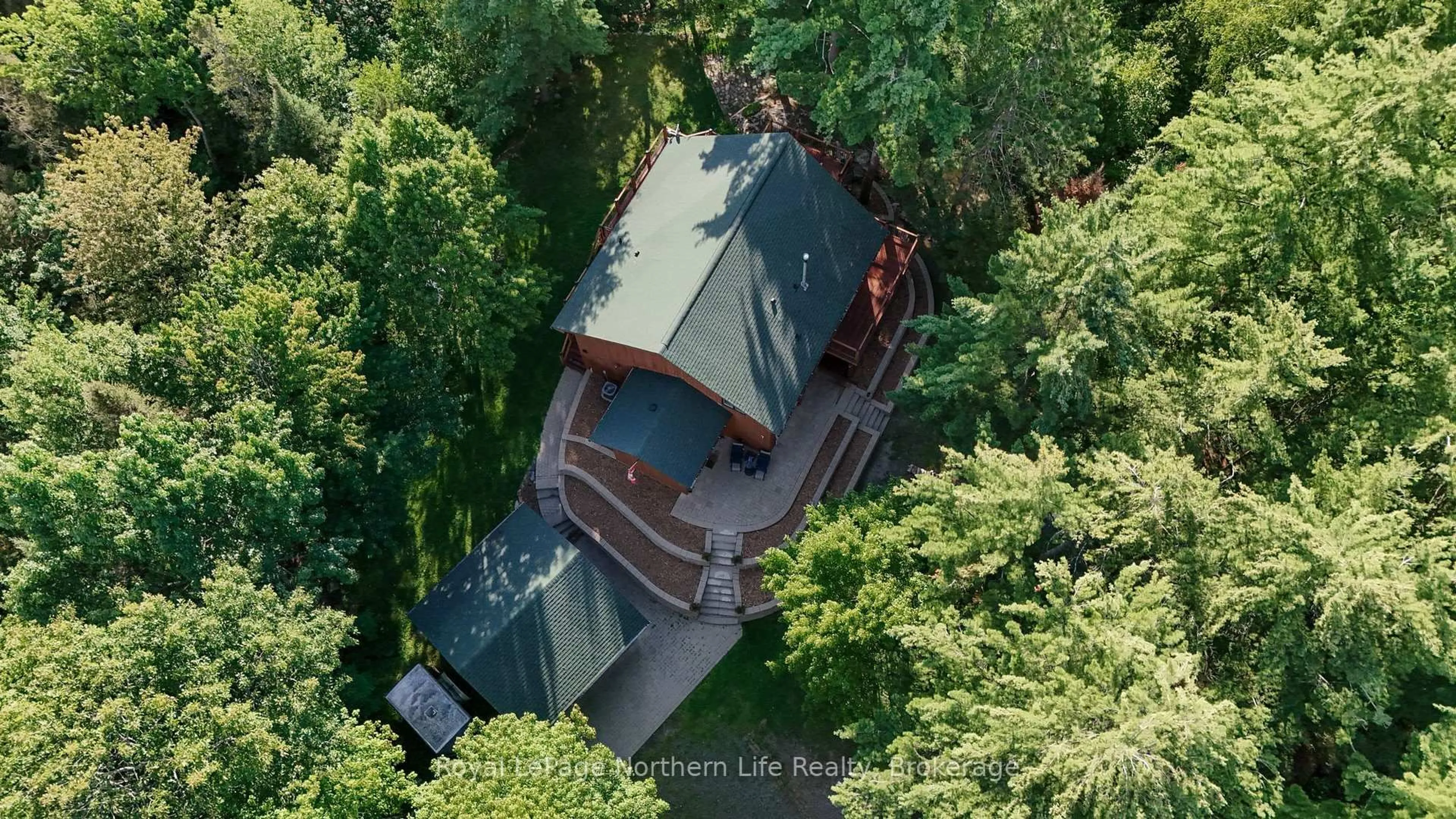 A pic from outside/outdoor area/front of a property/back of a property/a pic from drone, forest/trees view for 41 Pebble Beach Dr, Callander Ontario P0H 1H0