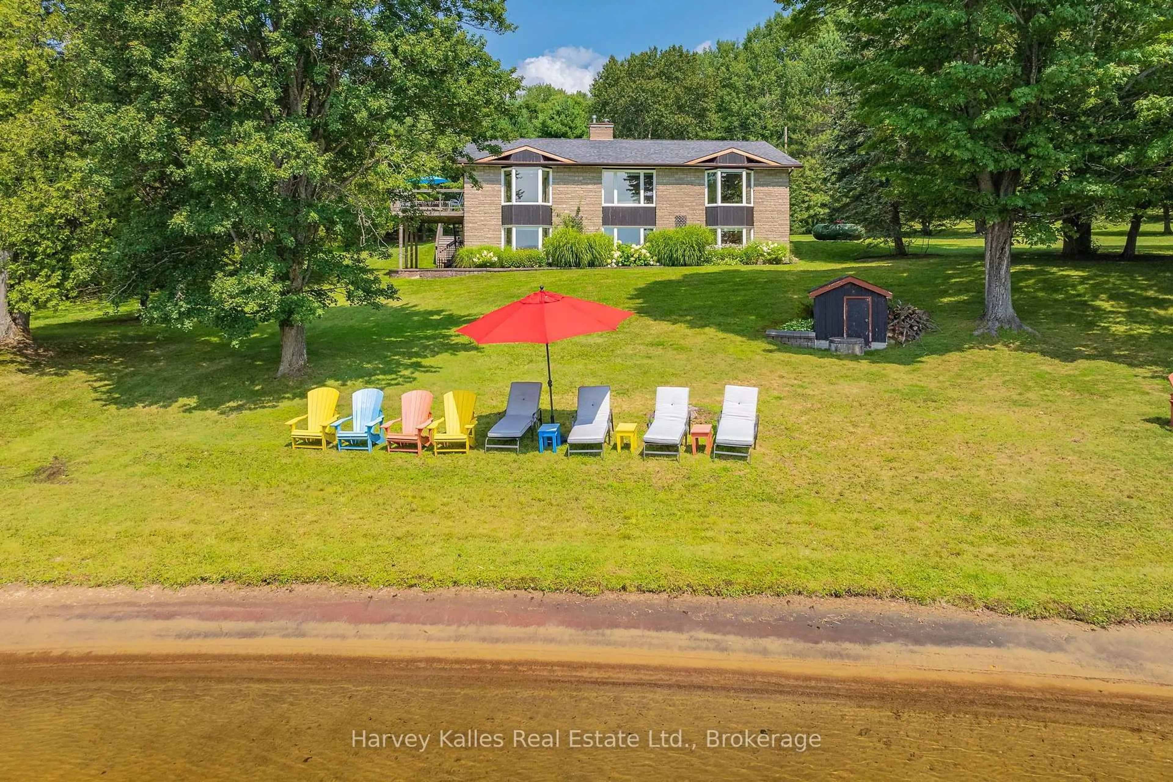 A pic from outside/outdoor area/front of a property/back of a property/a pic from drone, water/lake/river/ocean view for 1061 Sawmill Lane, Lake of Bays Ontario P1H 2J6