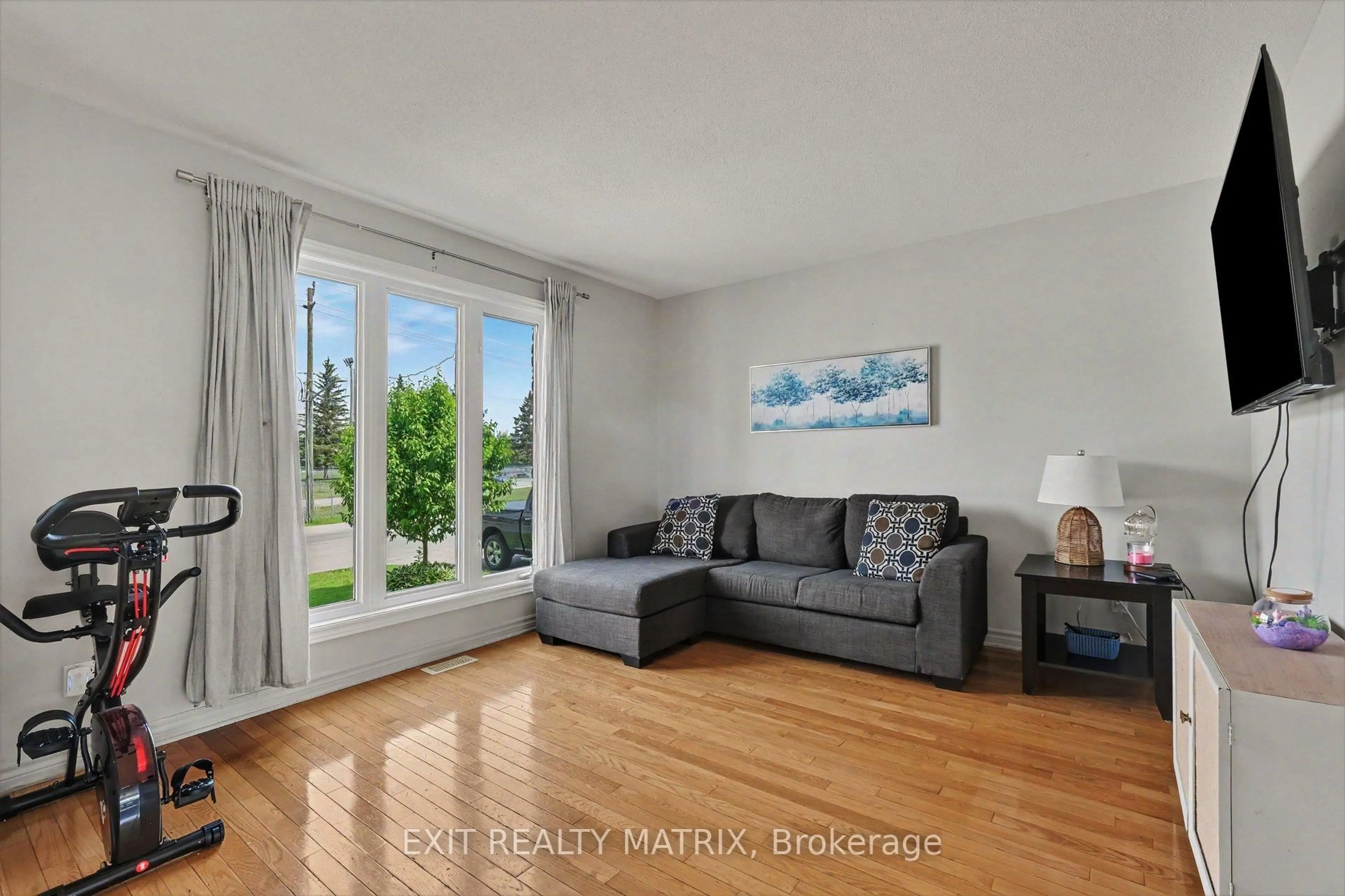 Living room with furniture, wood/laminate floor for 15 Blais St #B, Russell Ontario K0A 1W0