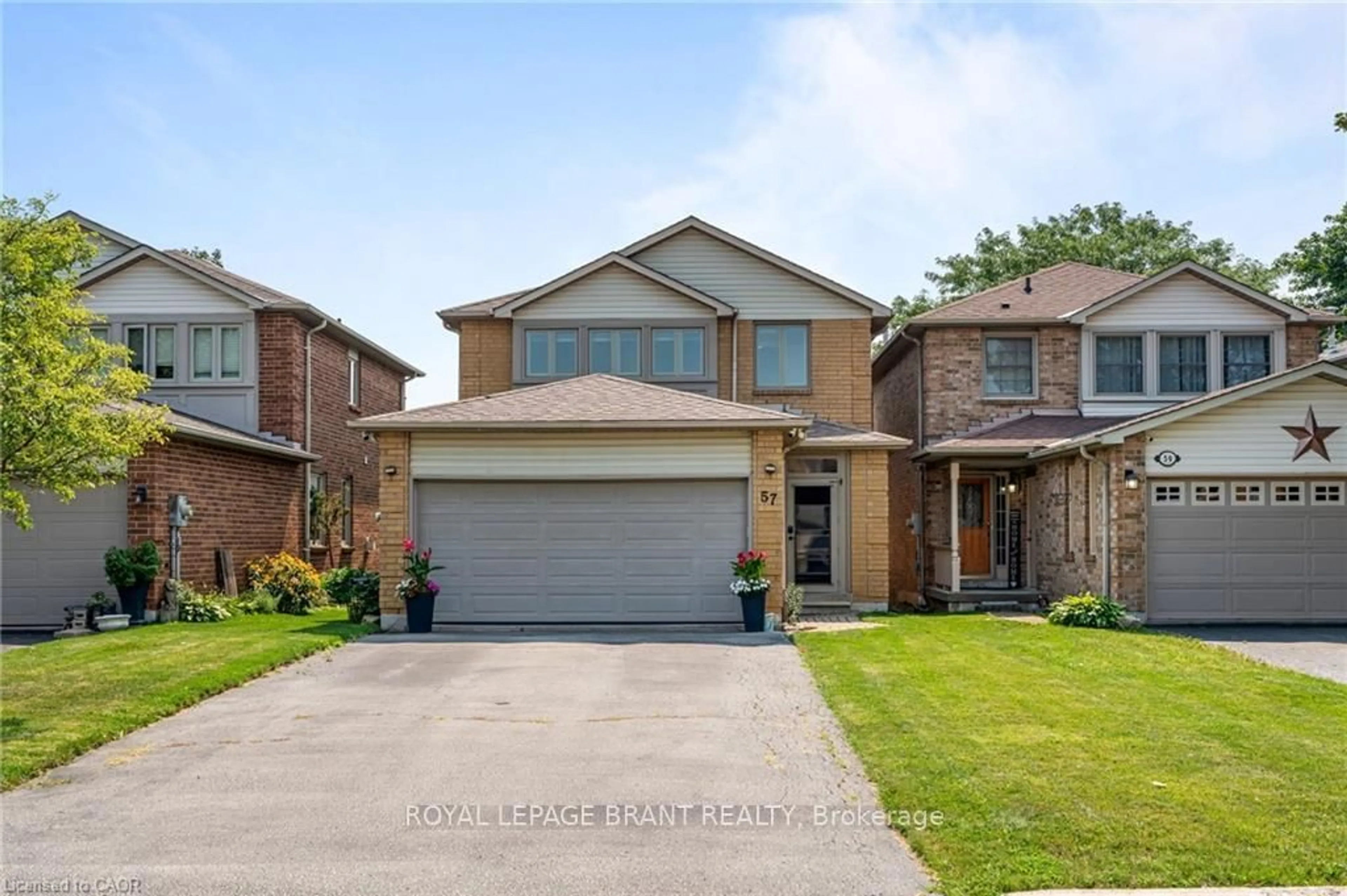 Home with brick exterior material, street for 57 Grindstone Way, Hamilton Ontario L9H 7B5