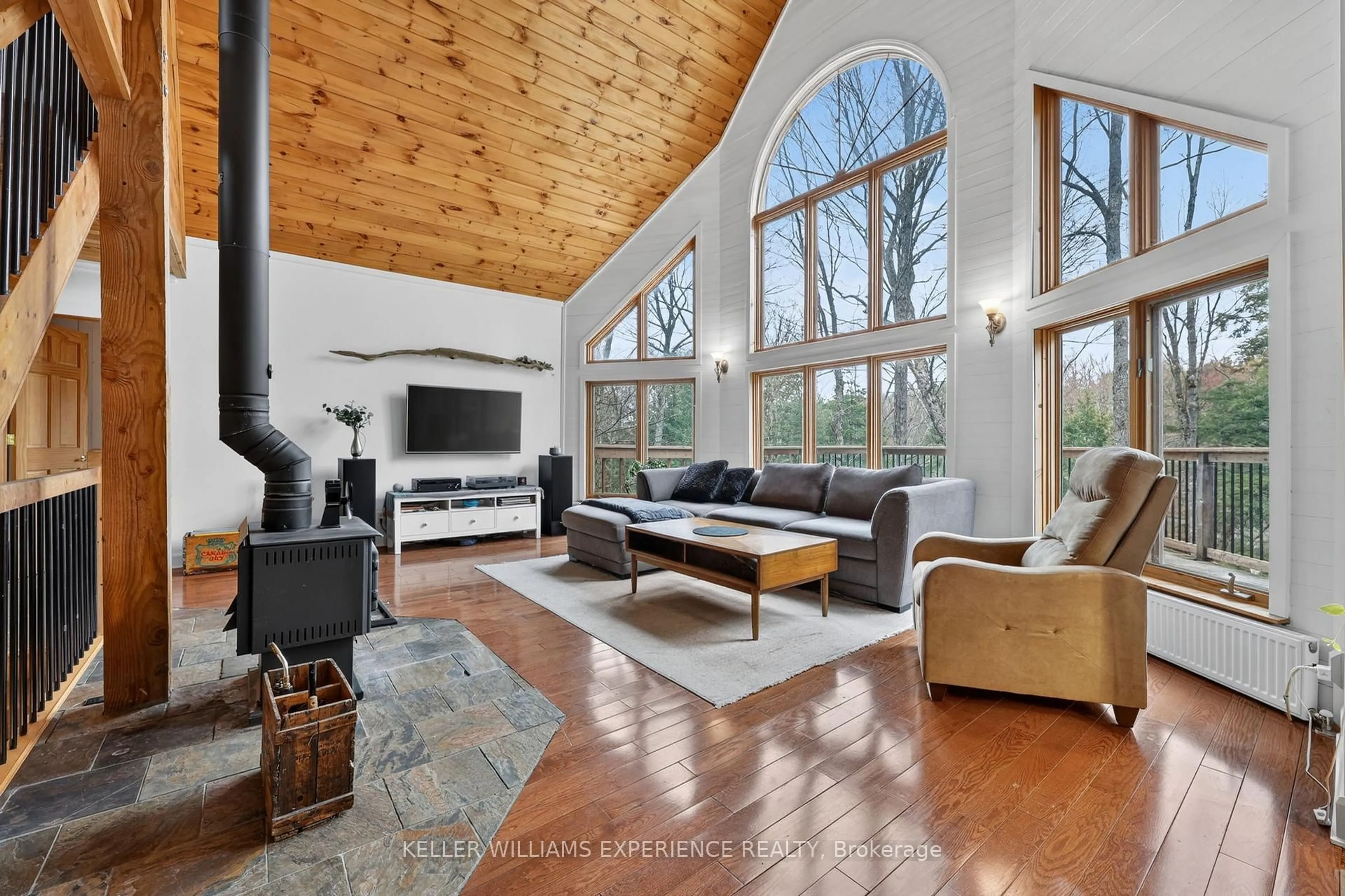 Living room with furniture, wood/laminate floor for 1115 Sherwood Forest Rd, Bracebridge Ontario P1L 1X3