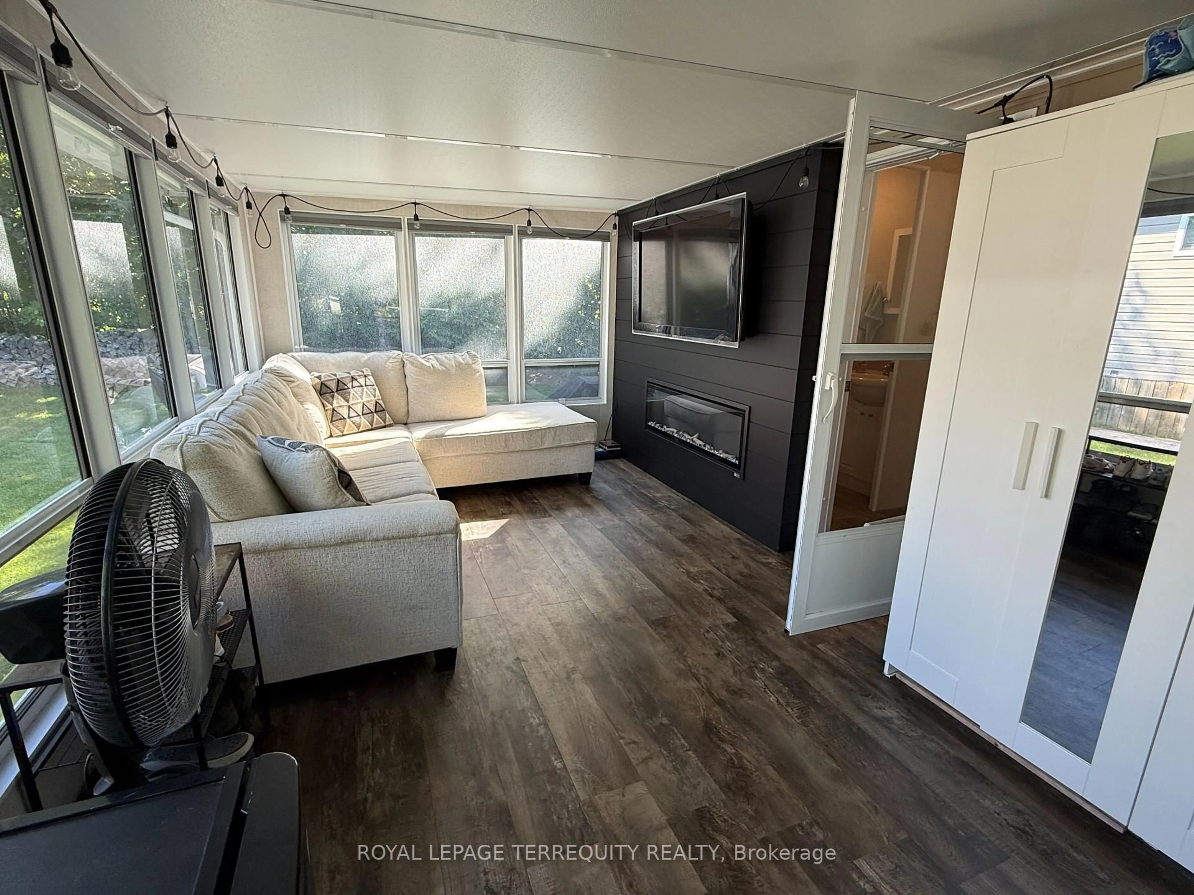 Living room with furniture, wood/laminate floor for 342 Butternut, Selwyn Ontario K0L 2H0