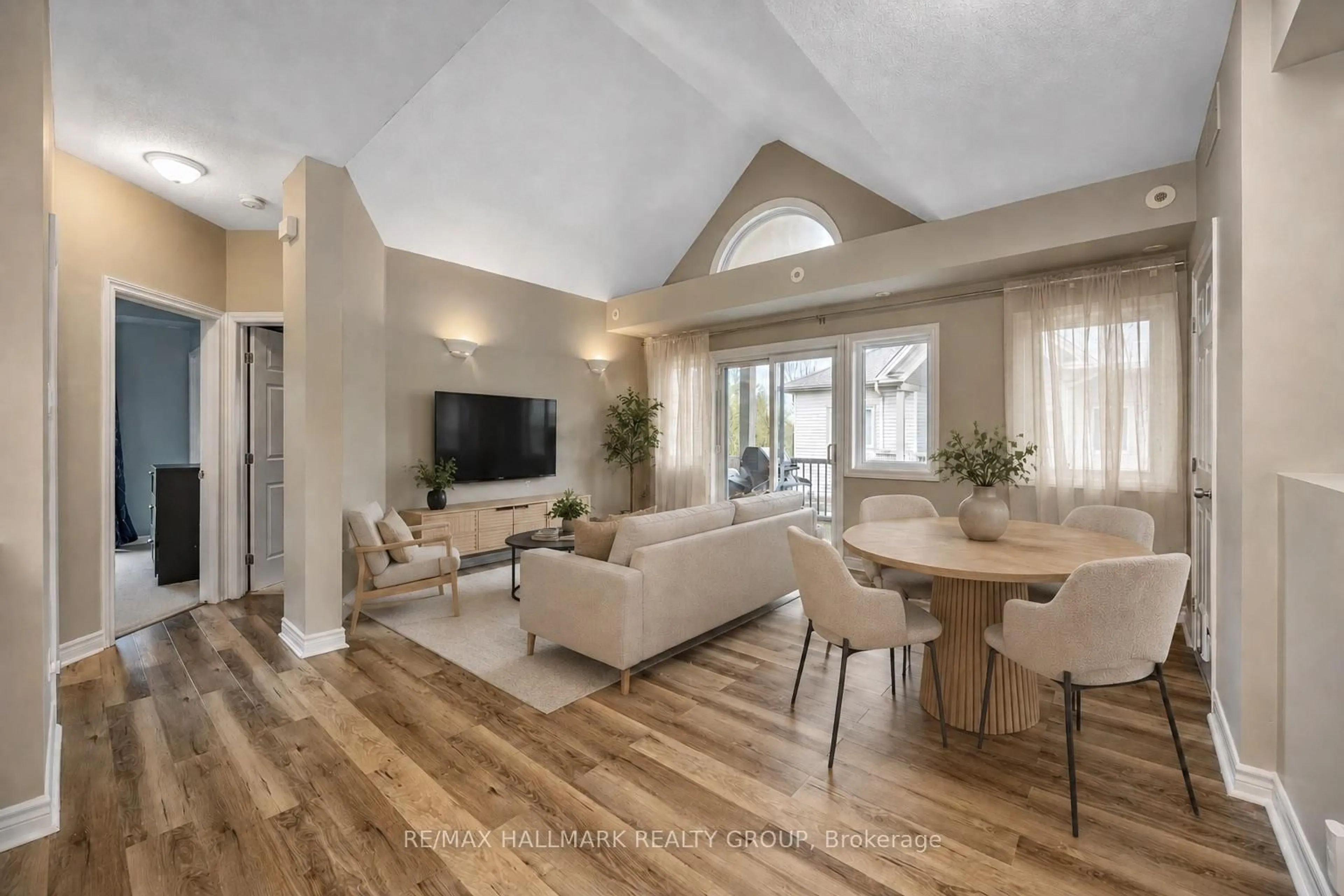Living room with furniture, wood/laminate floor for 1109 Stittsville Main St #L, Stittsville Ontario K2S 0C8